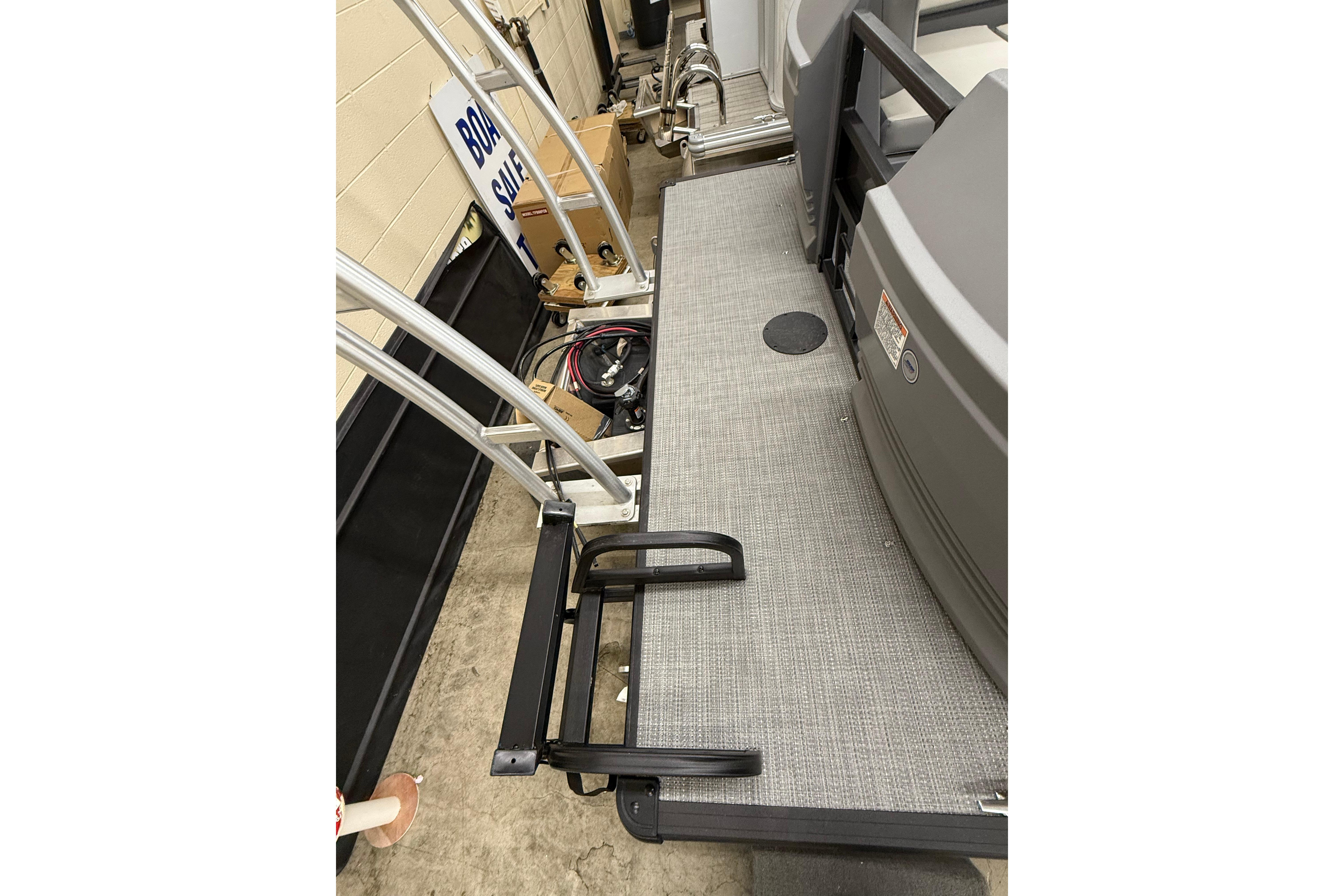 2025 SunChaser Lucerne 22 LR DH boat deck with ladder and railing.