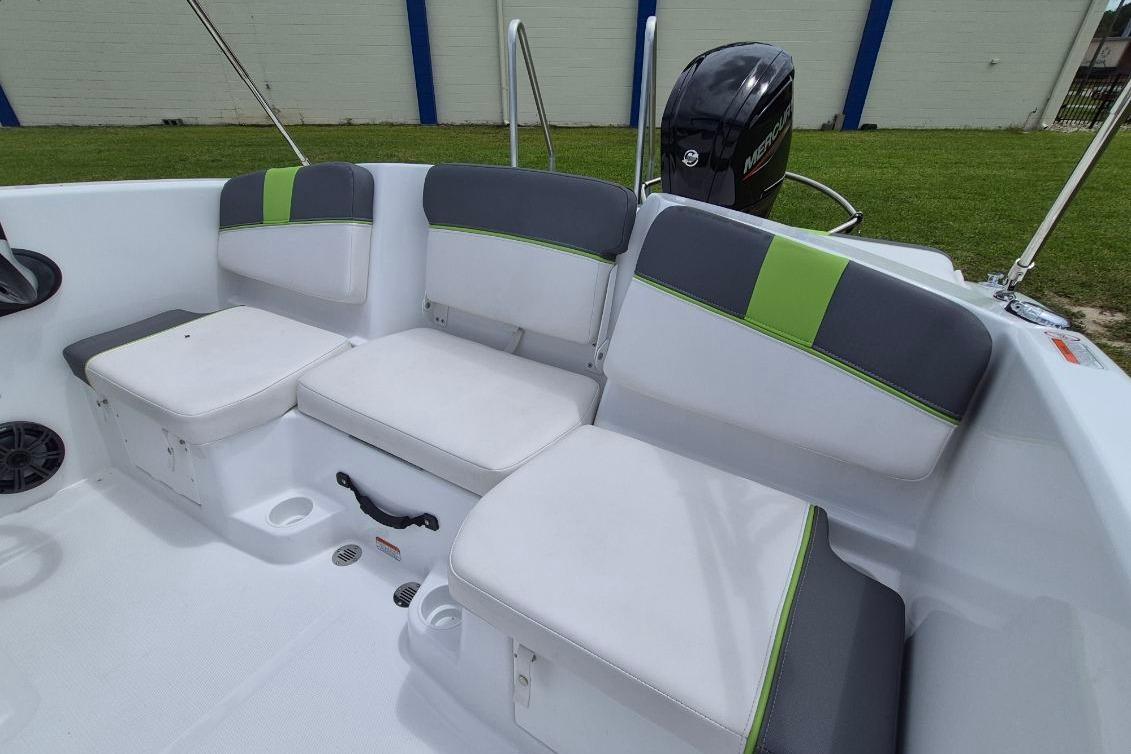 2021 Tahoe T16 boat interior with gray and green cushioned seating.