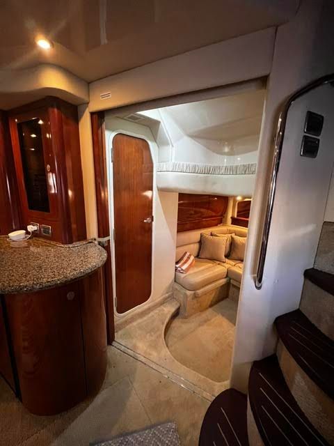 Interior of a 2006 Sea Ray 44 Sundancer yacht with cozy seating area.