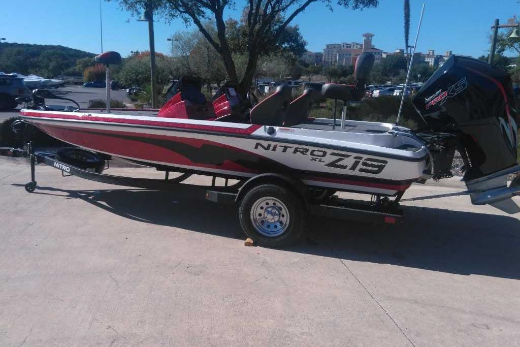 2026 Nitro Z19 XL boat on trailer, parked outdoors in a sunny setting.