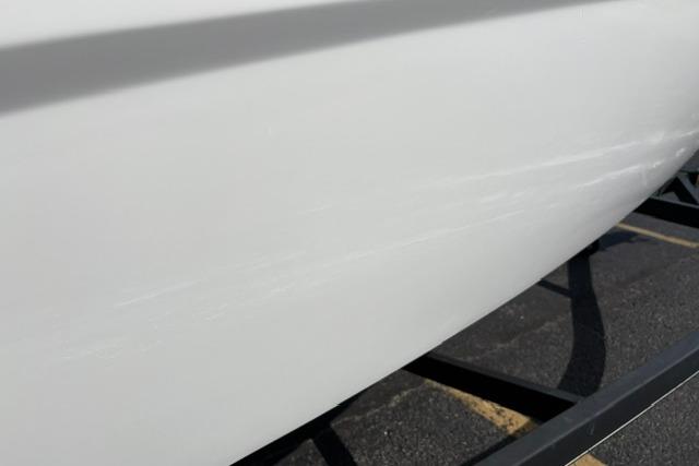 2024 Tahoe T21 boat hull on trailer, showcasing sleek white design.