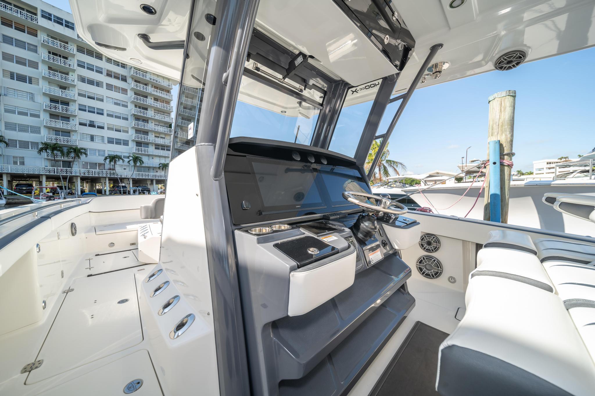 Interior of 2022 World Cat 400 CC-X boat with modern helm and seating.