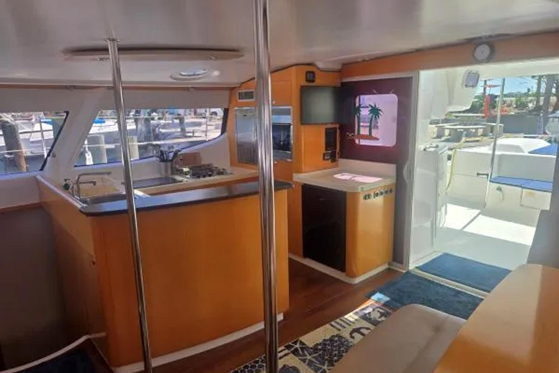 Interior of 2008 Fountaine Pajot Salina 48 catamaran with modern kitchen and seating area.