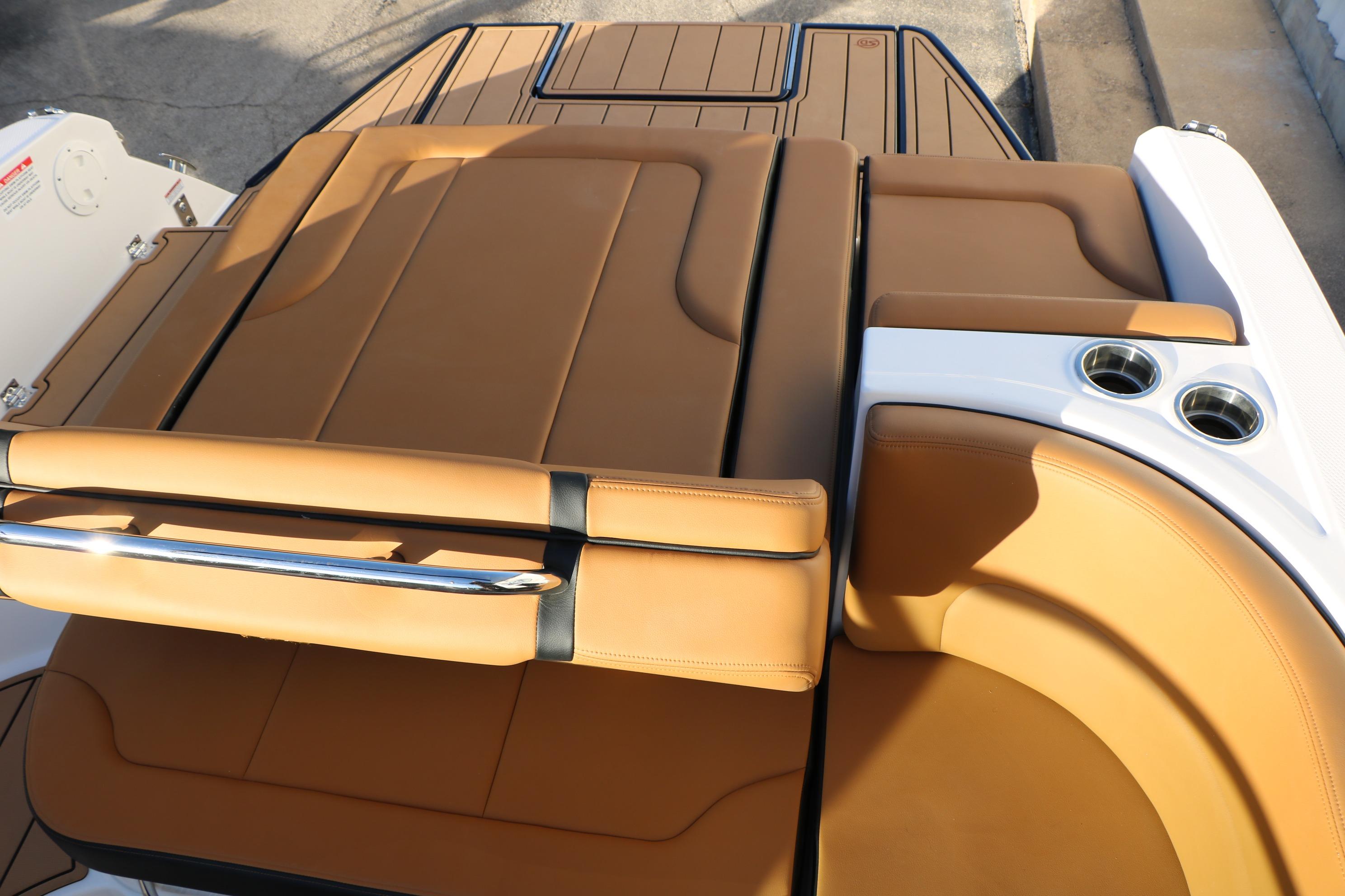 2026 Chaparral 247 SSX boat with tan leather seating and cup holders.