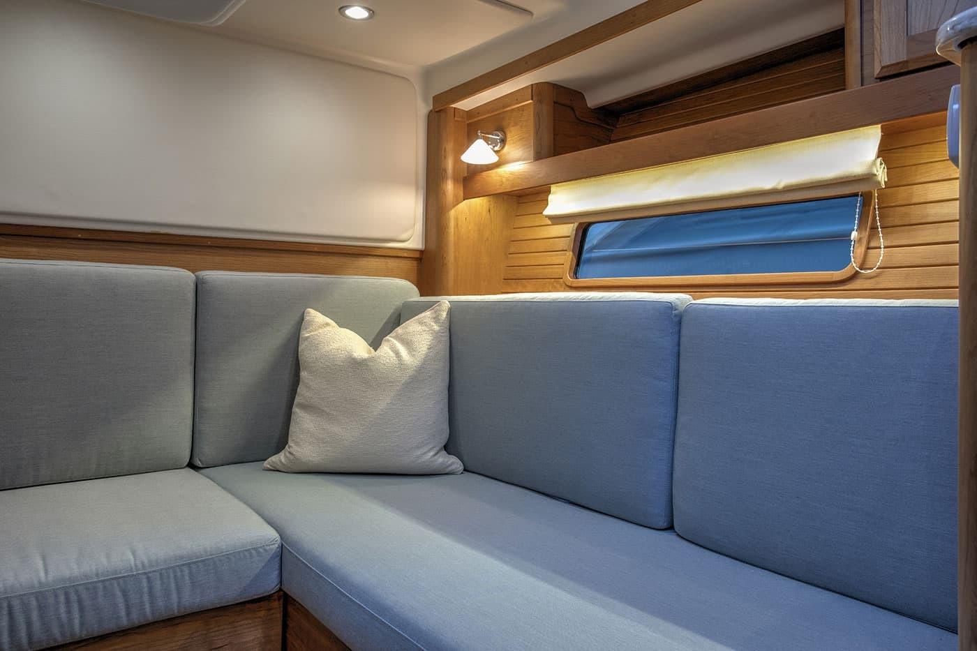 Interior of 2026 Sabre 38 Salon Express with cozy seating and soft lighting.
