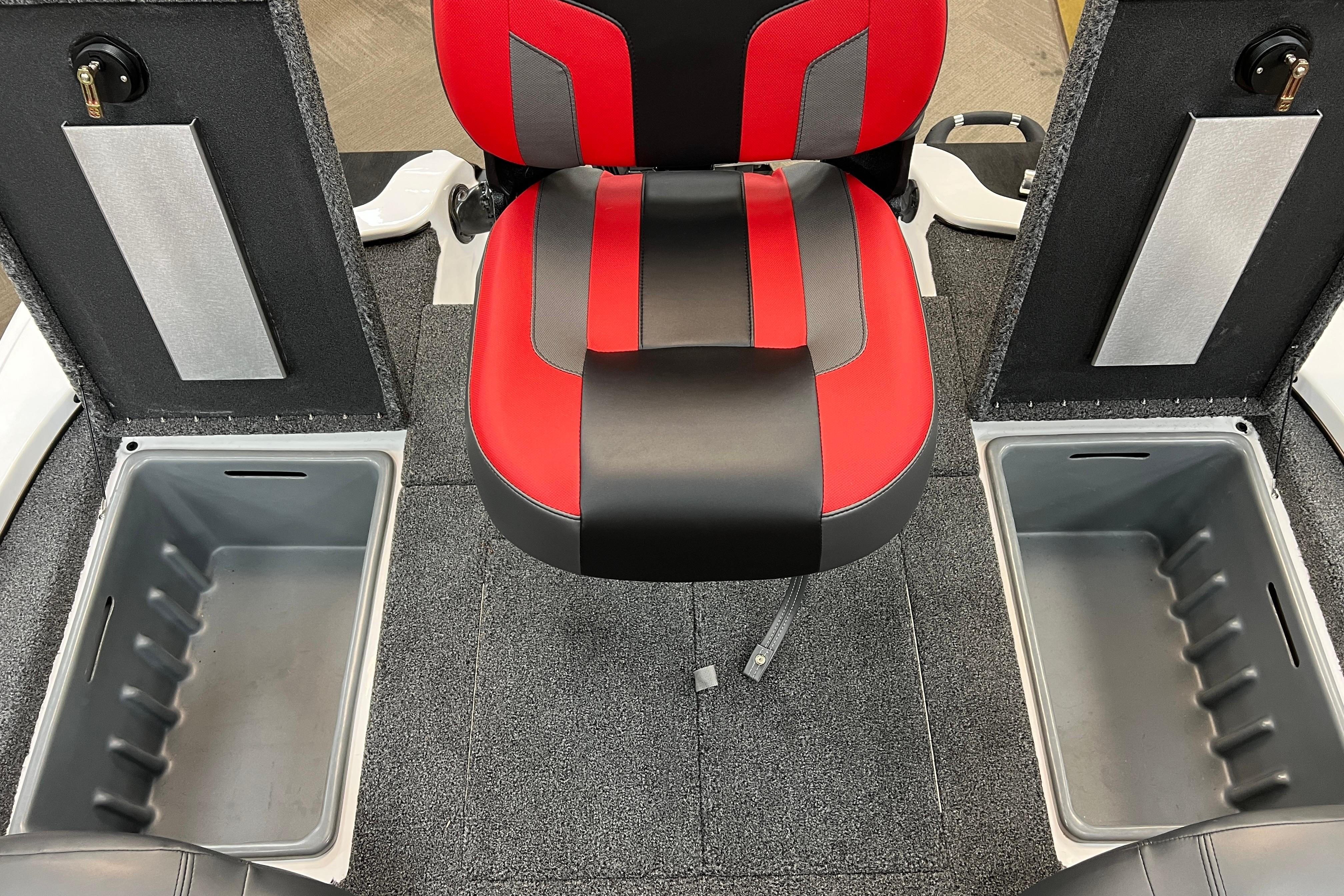 Red and black seat on a 2026 Nitro Z17 boat with storage compartments open.