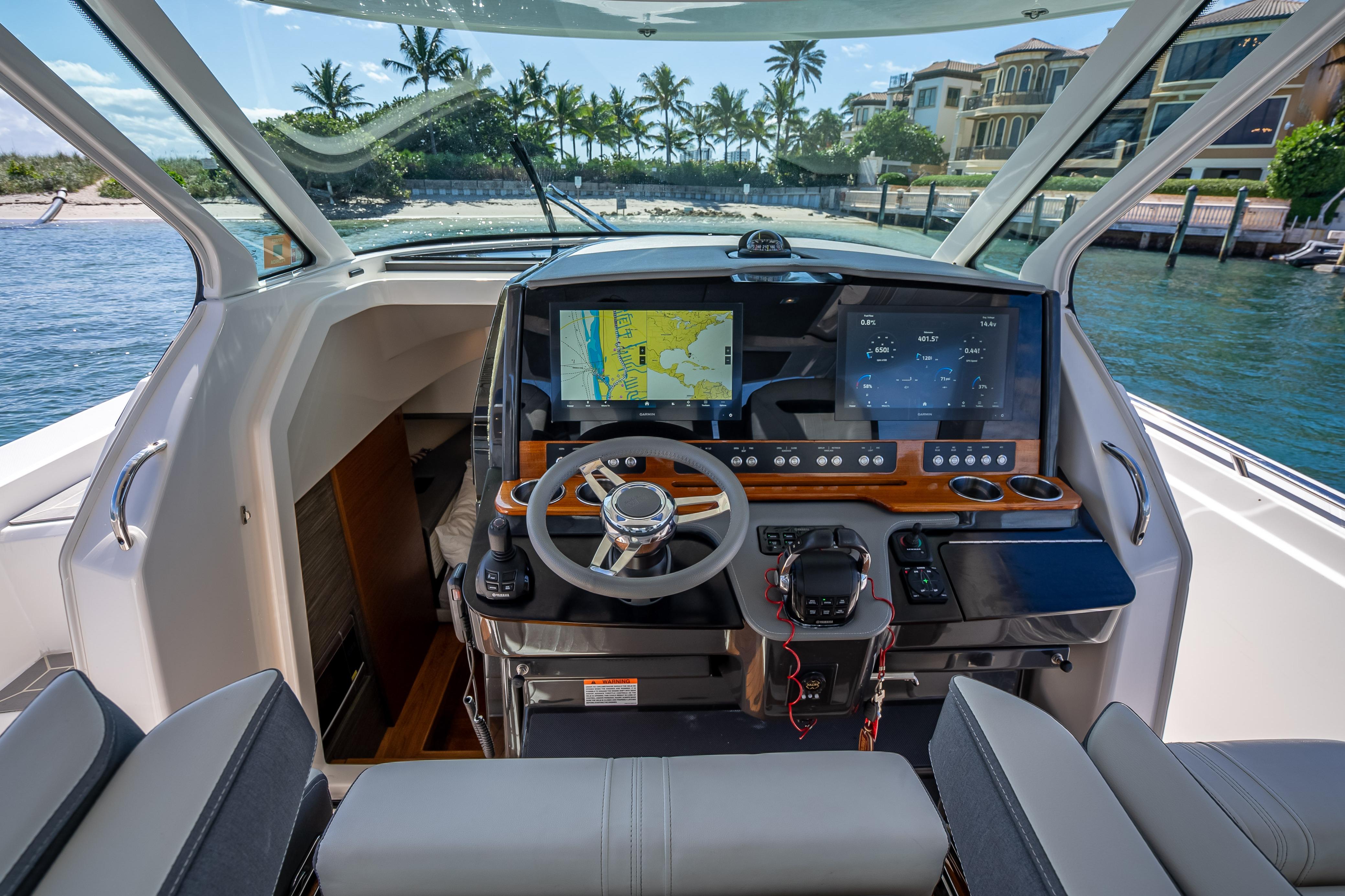 2019 Tiara Sport 38 LS boat helm with advanced navigation displays and luxurious seating.