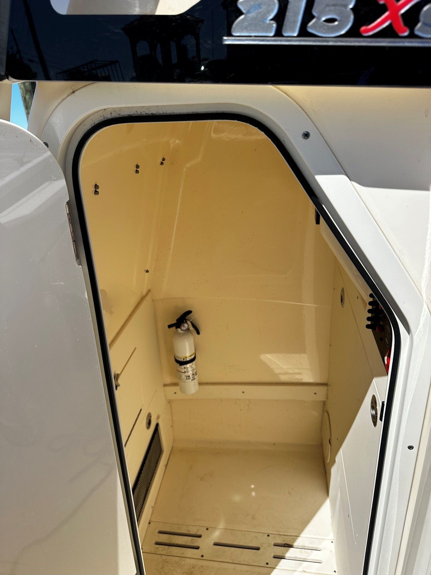 Interior of a 2022 Scout 210XSF boat with fire extinguisher.