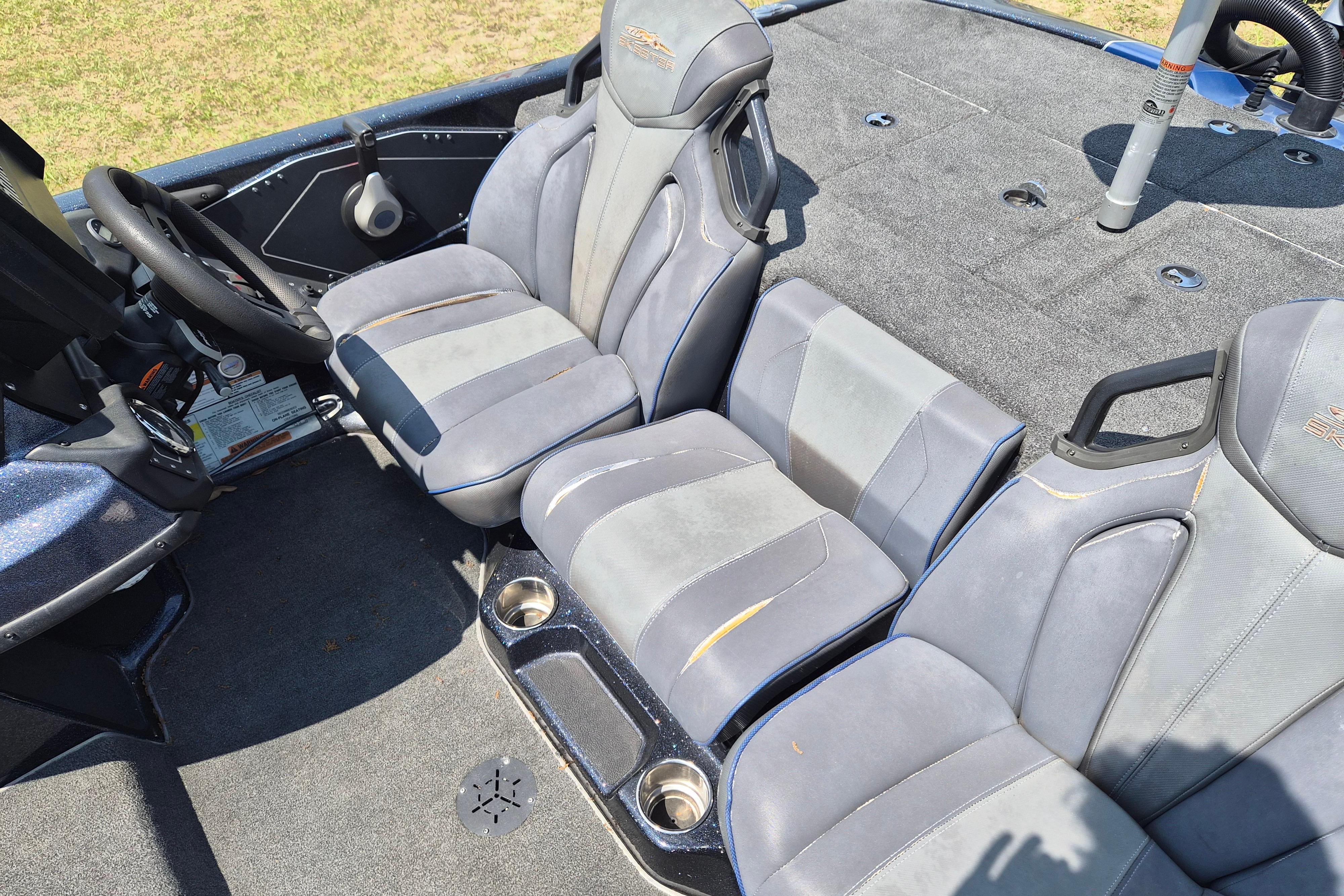 Interior of a 2021 Skeeter ZXR20 boat with gray seating and steering wheel.