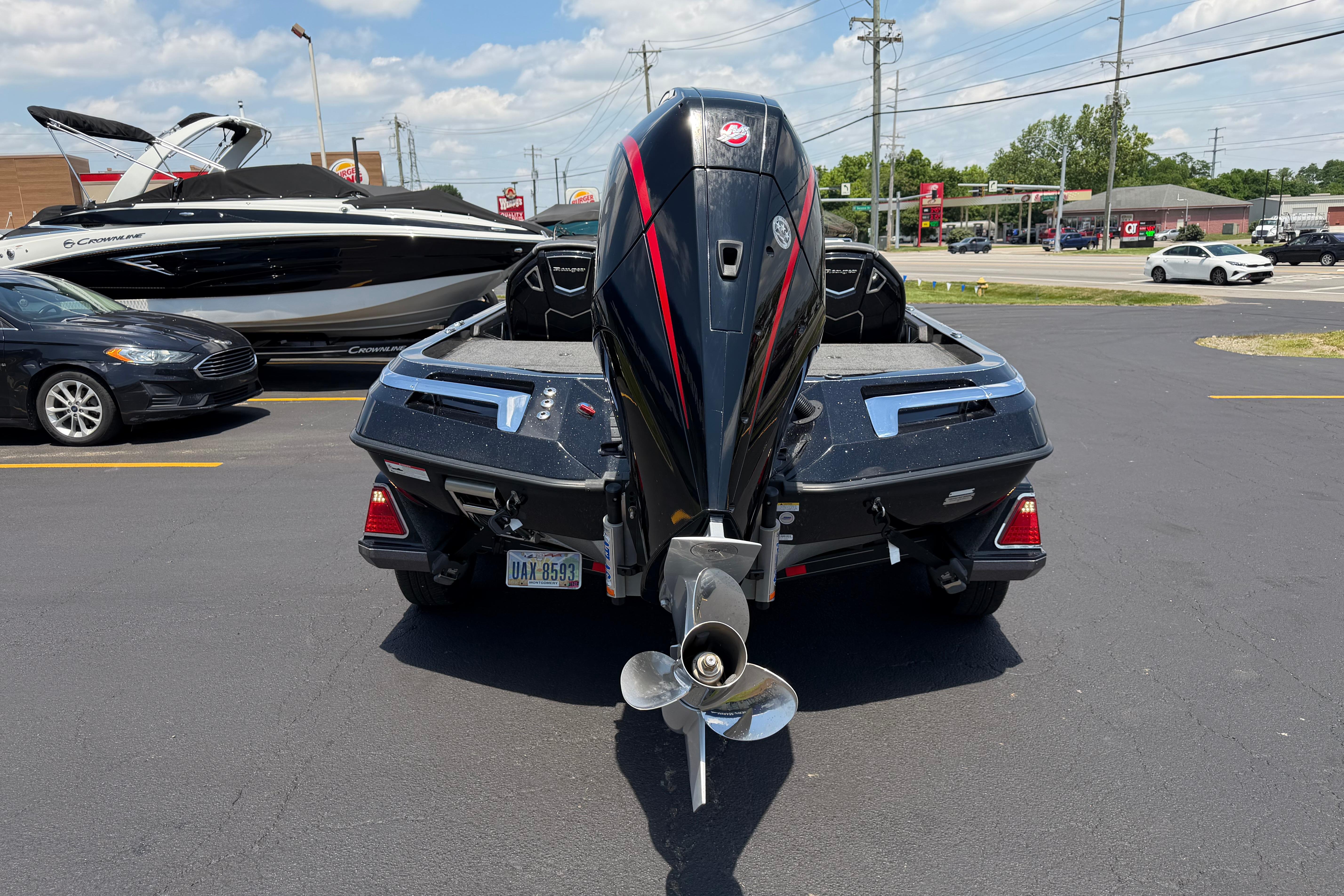 2023 Ranger Z520R boat with powerful outboard motor in a parking lot.