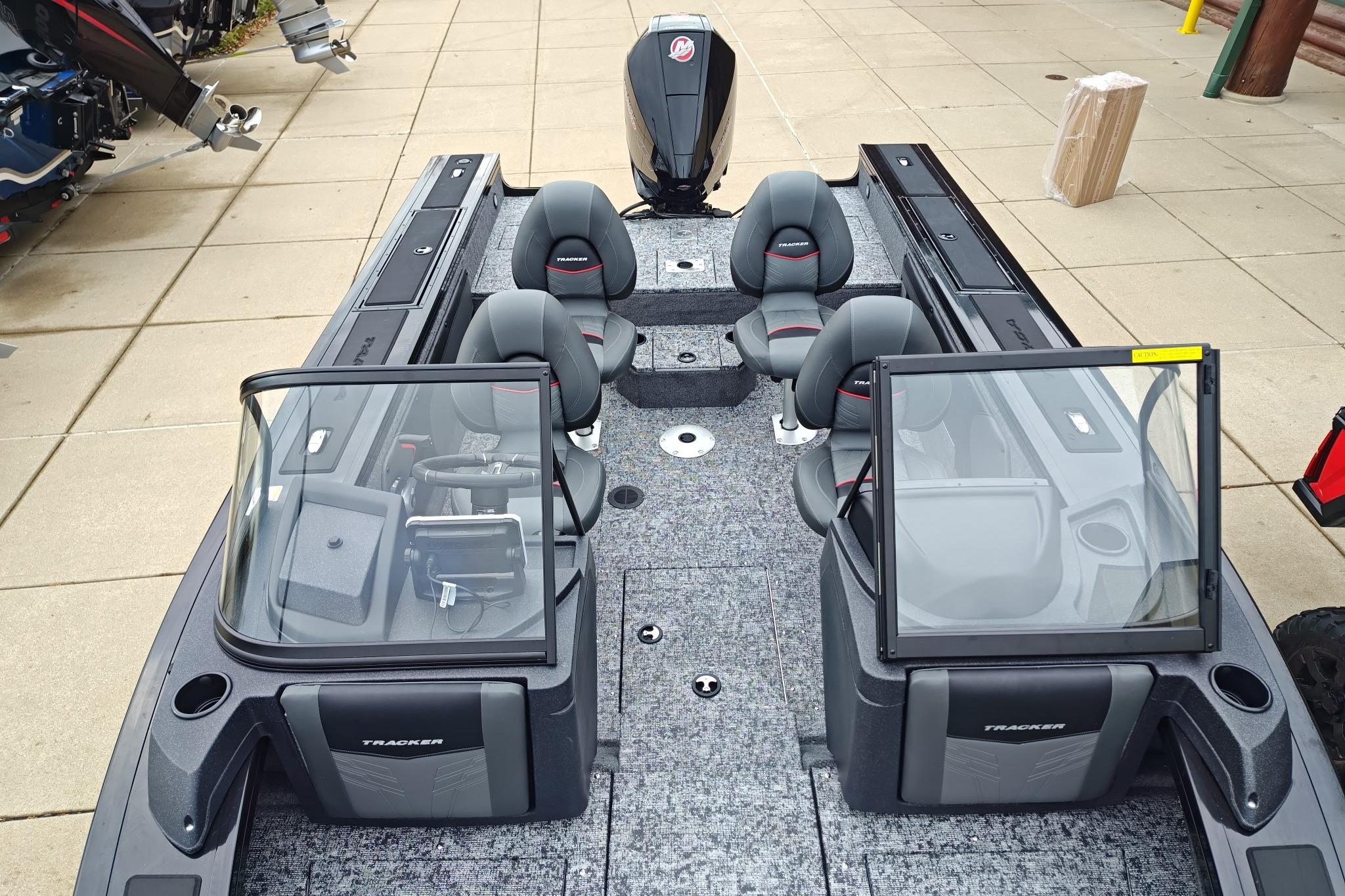 2026 Tracker Targa V-19 WT boat interior with seating and console, displayed outdoors.