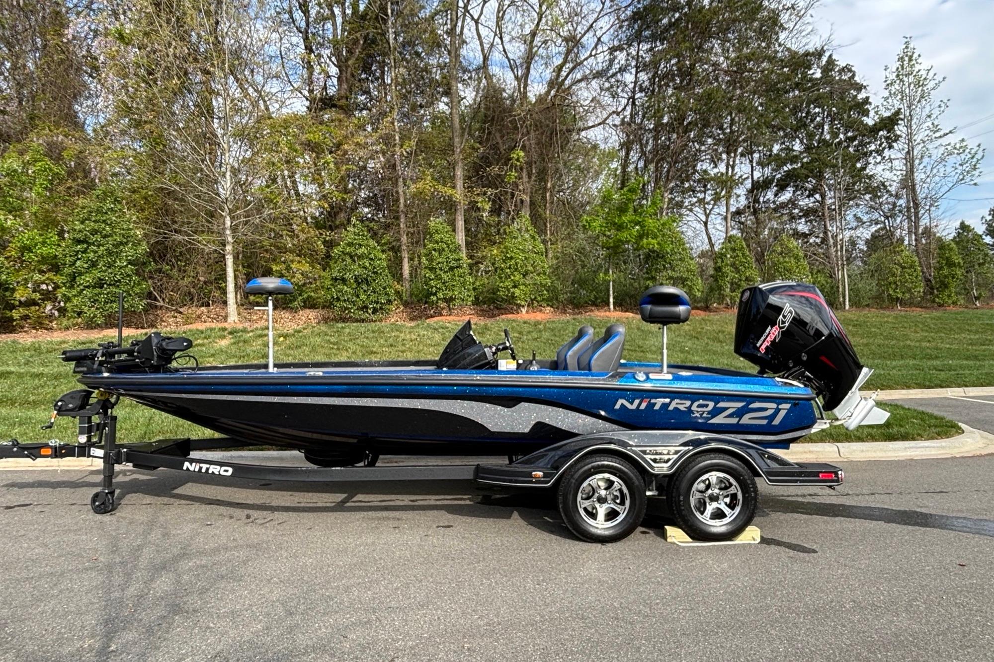2026 Nitro Z21 XL Pro bass boat on trailer, parked outdoors.