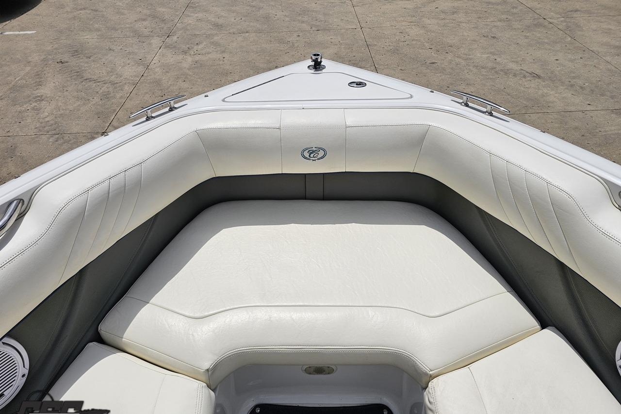 2010 Cobalt 232 WSS boat interior with white cushioned seating and sleek design.