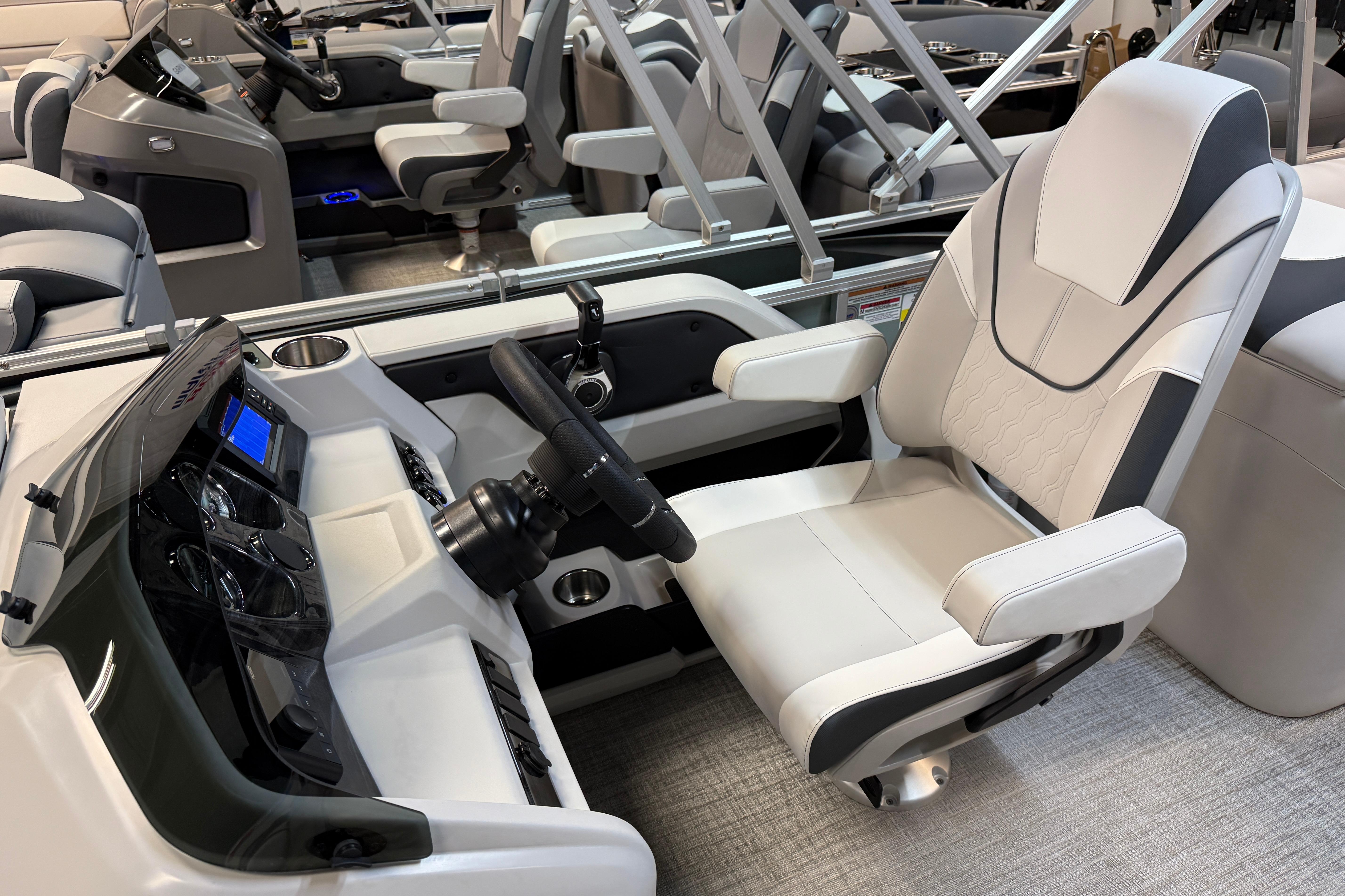 2026 Tahoe Pontoon LTZ Quad Lounger interior with modern helm and luxurious seating.