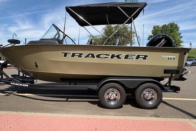 2026 Tracker Targa V-18 WT boat on trailer, parked outdoors under clear sky.