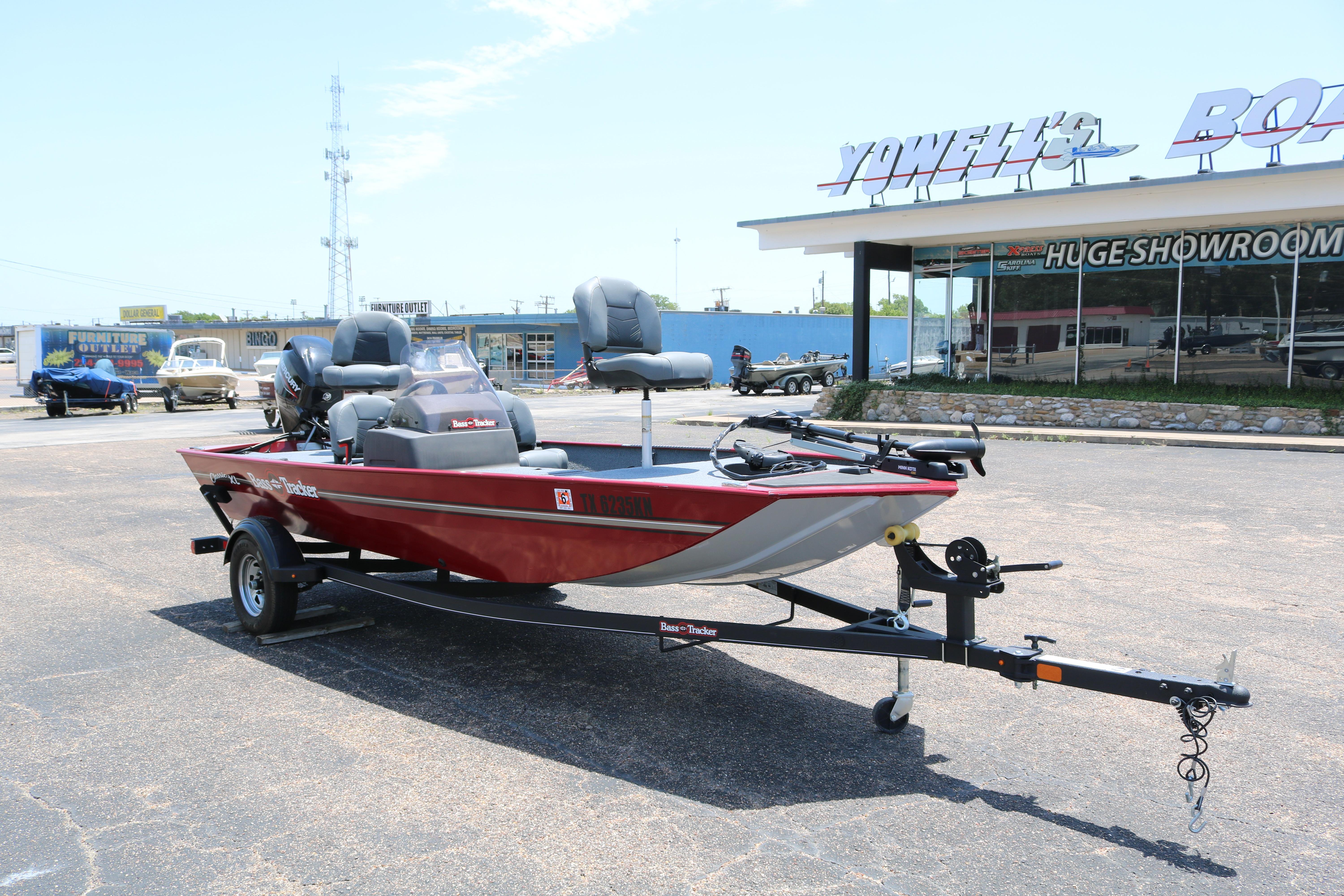 2021 Tracker Bass Tracker Classic XL boat on trailer outside showroom.