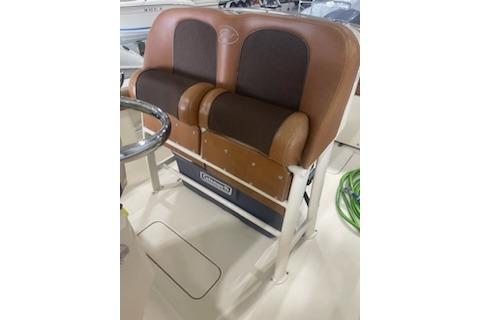 2015 Scout 255 LXF boat seating with brown leather upholstery and stainless steel accents.