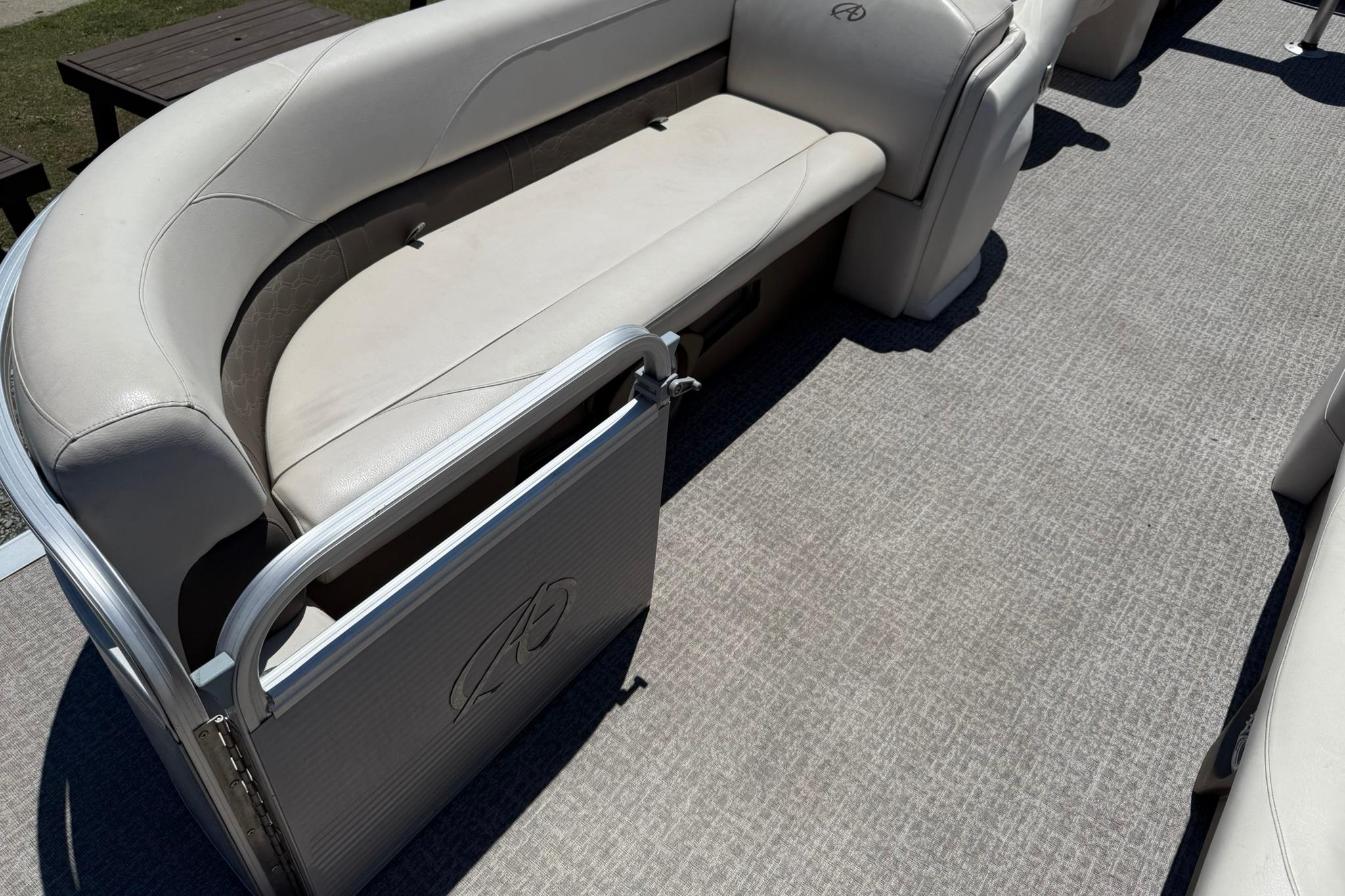 2019 Avalon GS Quad Lounge 25' boat interior with beige seating and carpeted floor.