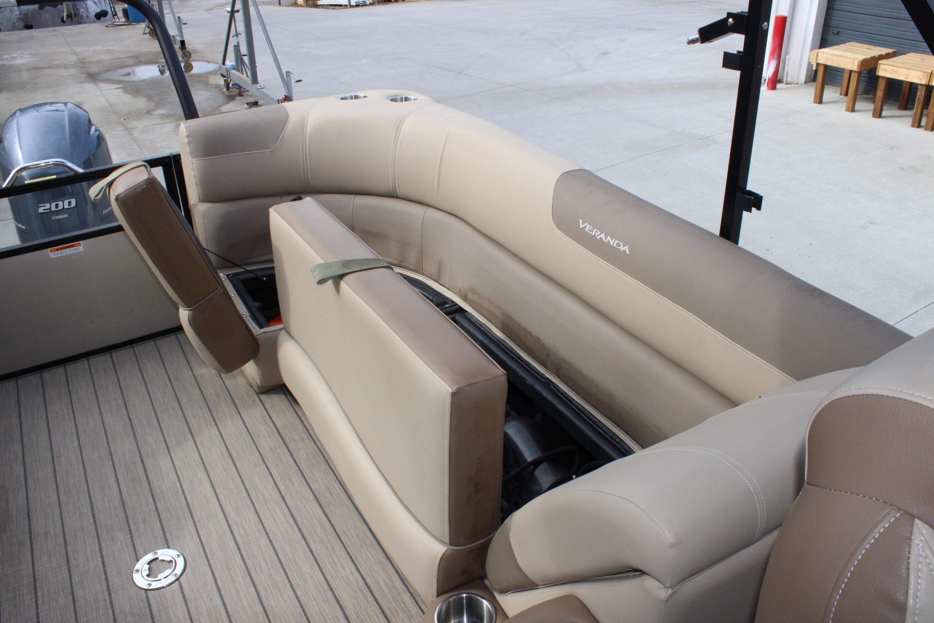 2023 Veranda VR22RC boat interior with beige seating and storage compartments.