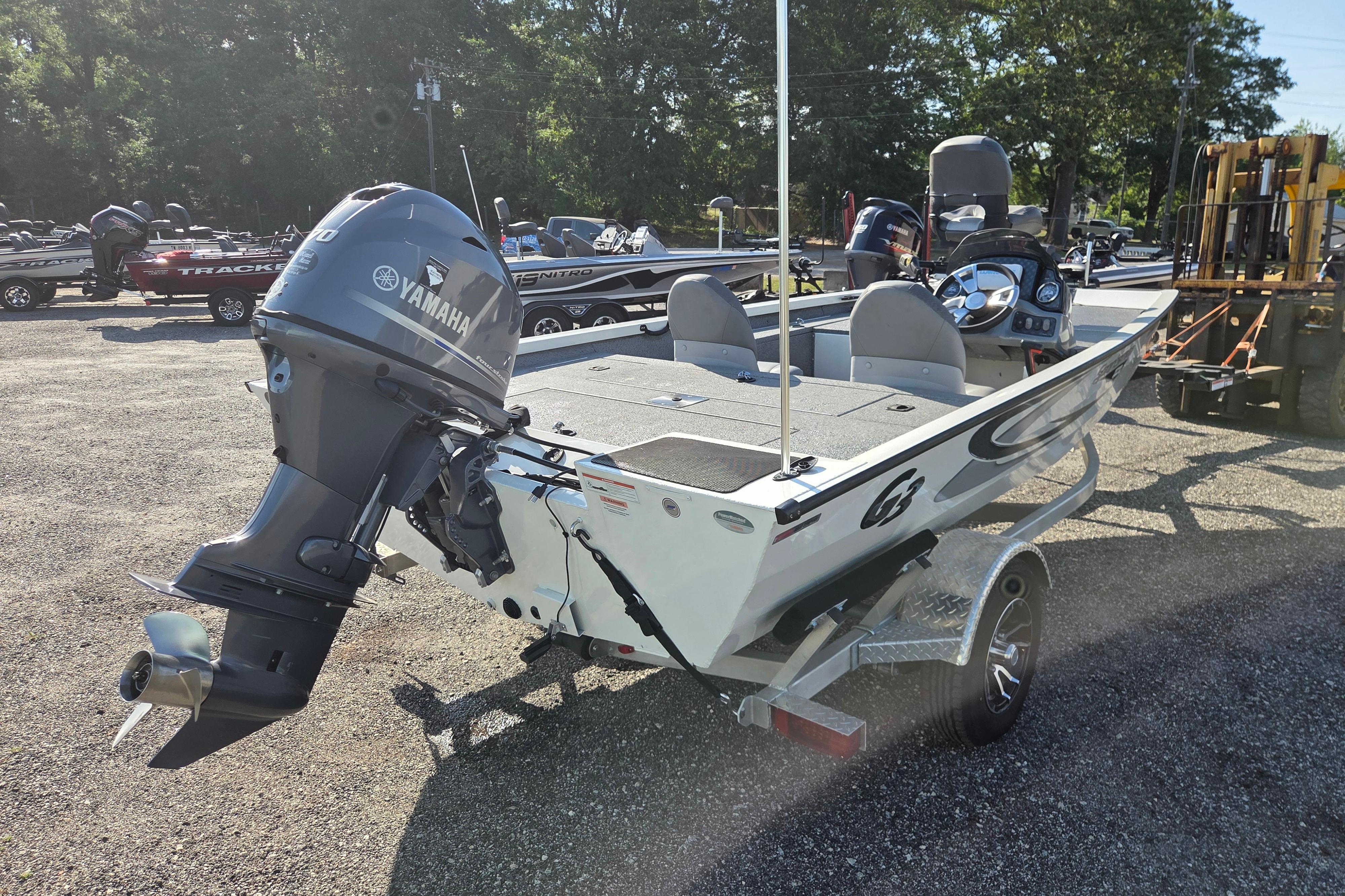 2022 G3 Sportsman 1610 boat with Yamaha outboard motor, parked outdoors.