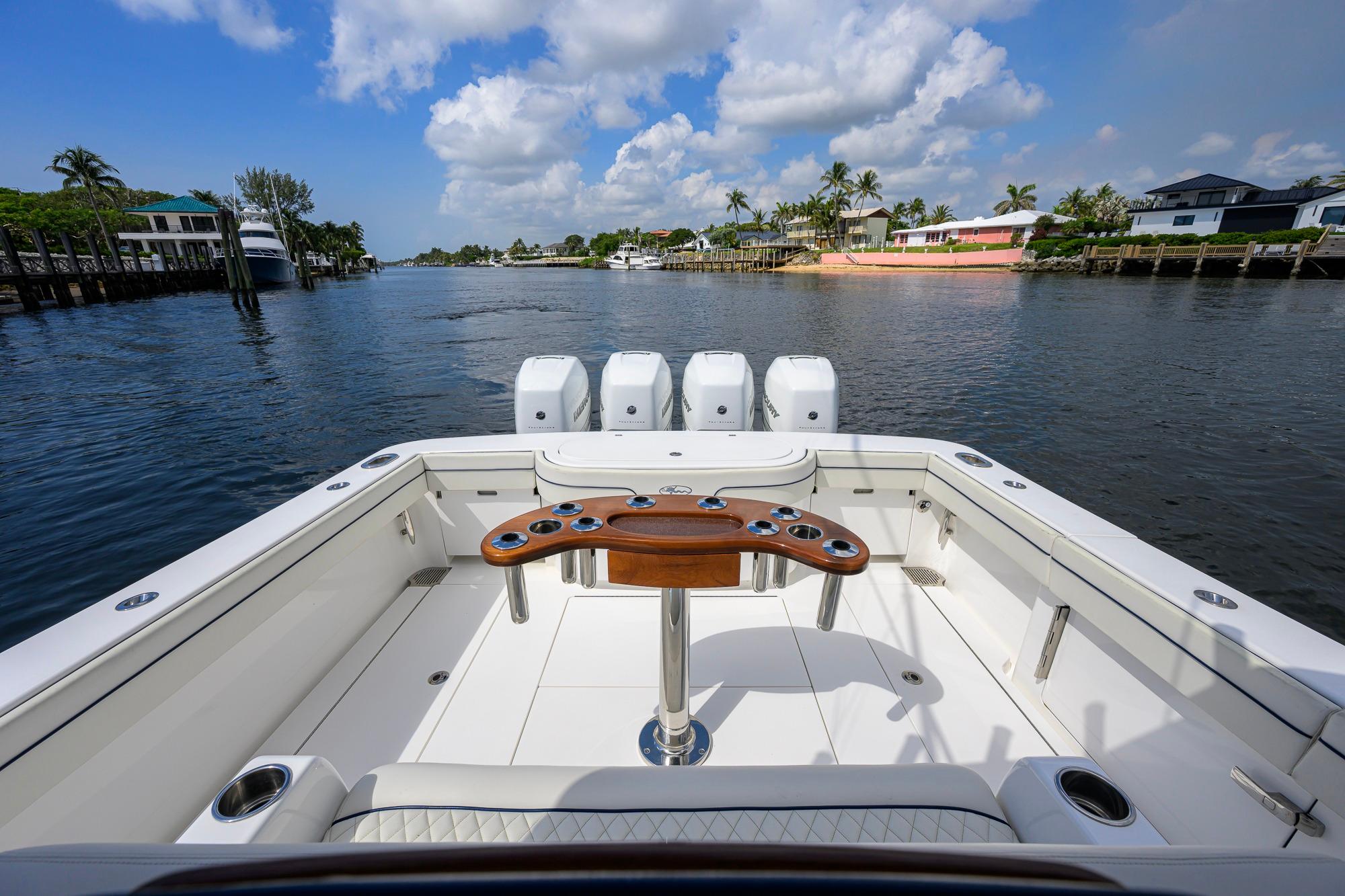 2020 Valhalla Boatworks V-41 on calm water, featuring spacious deck and multiple engines.
