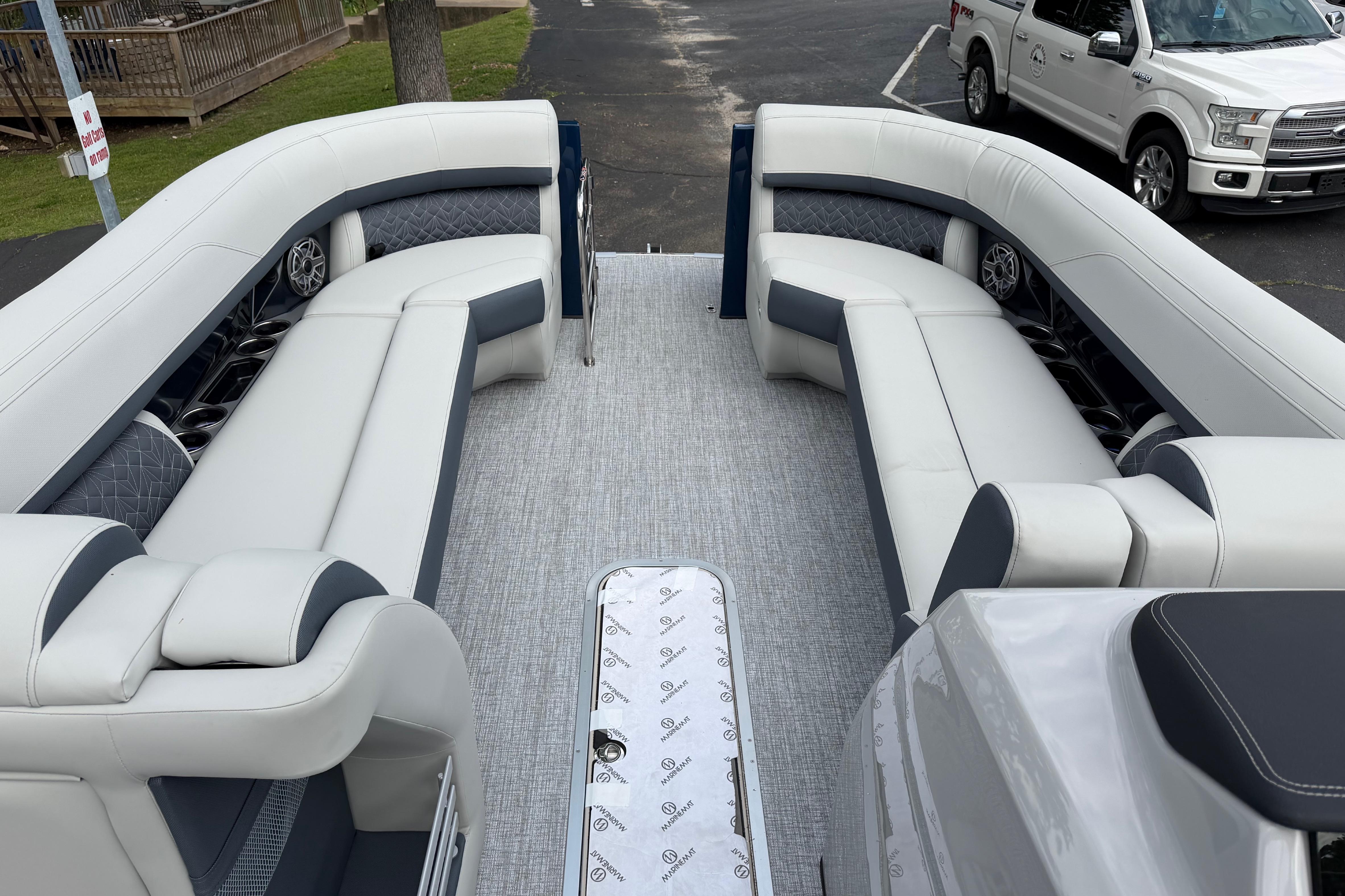 Luxurious seating on 2026 Harris Grand Mariner 250 CWDH pontoon boat, featuring elegant upholstery.