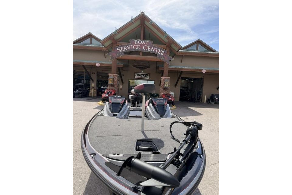 Nitro Z18 2026 boat at service center entrance under clear sky.