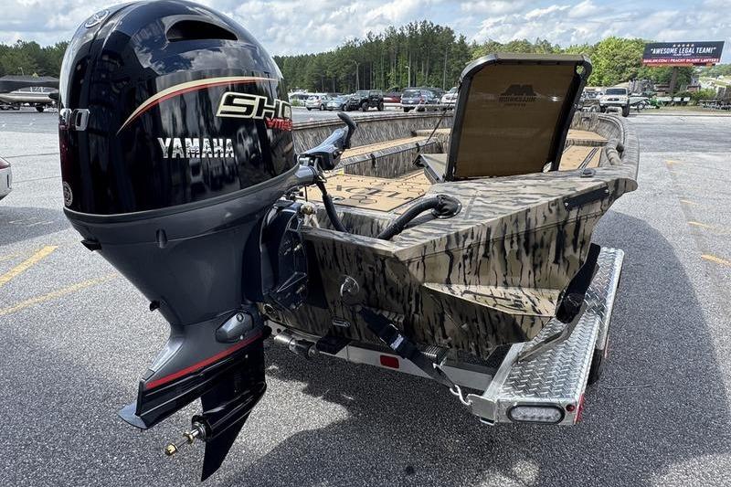 2026 Excel 183 Tomahawk boat with Yamaha motor on trailer in parking lot.