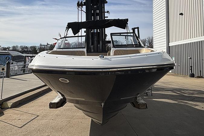 2023 Bayliner VR5 Bowrider OB boat displayed outdoors on a sunny day.