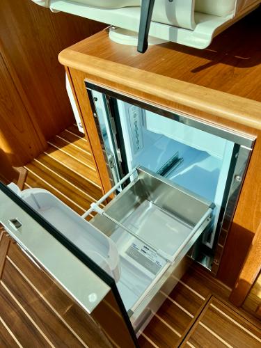 2025 Sabre 43 Salon Express interior with open drawer refrigerator.
