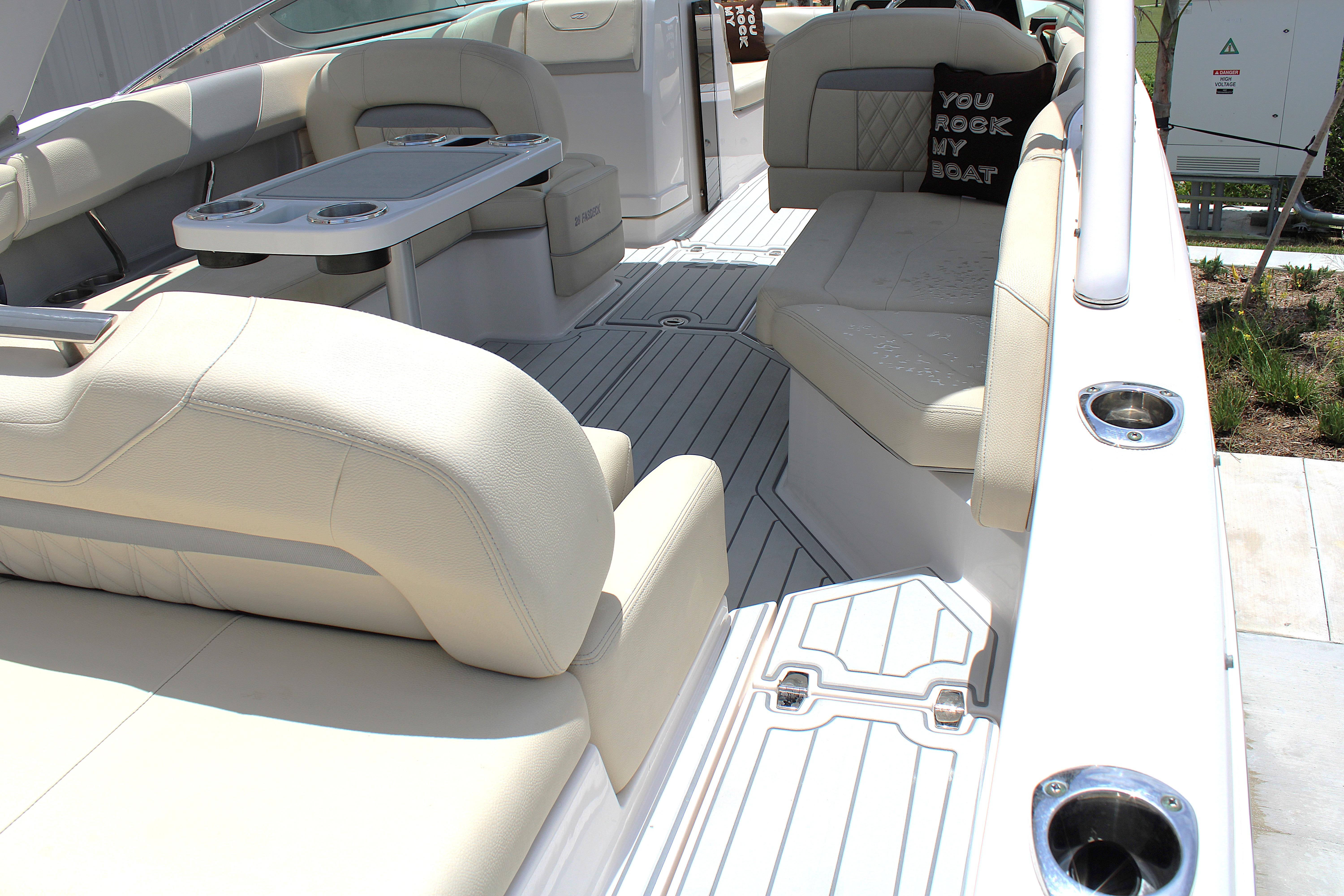 2021 Regal 26 OBX boat interior with beige seating and table.