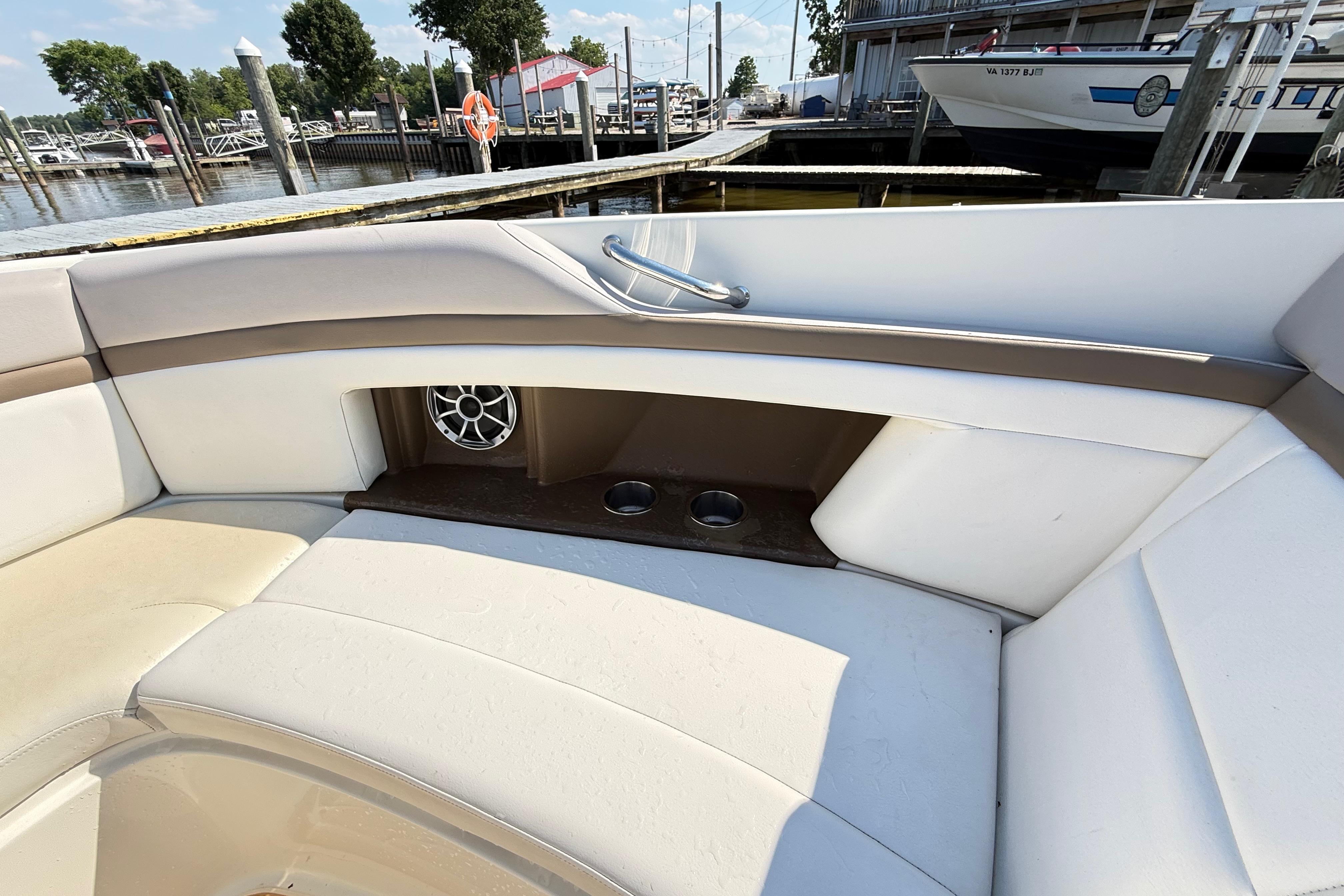 Interior seating of a 2011 Sea Ray 270 SLX boat at a marina.