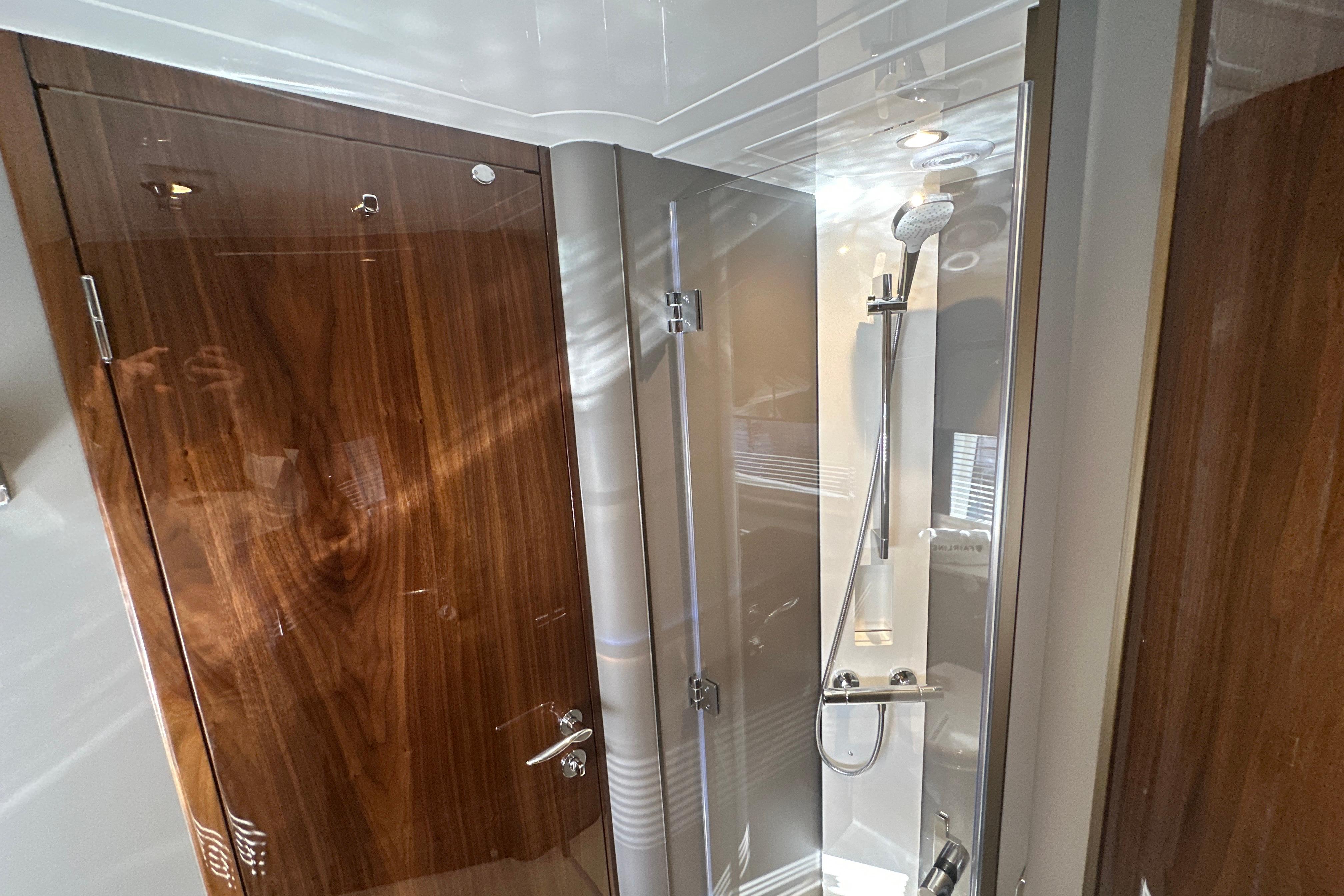 Luxurious bathroom interior of 2026 Fairline Targa 47 GT yacht with sleek shower design.