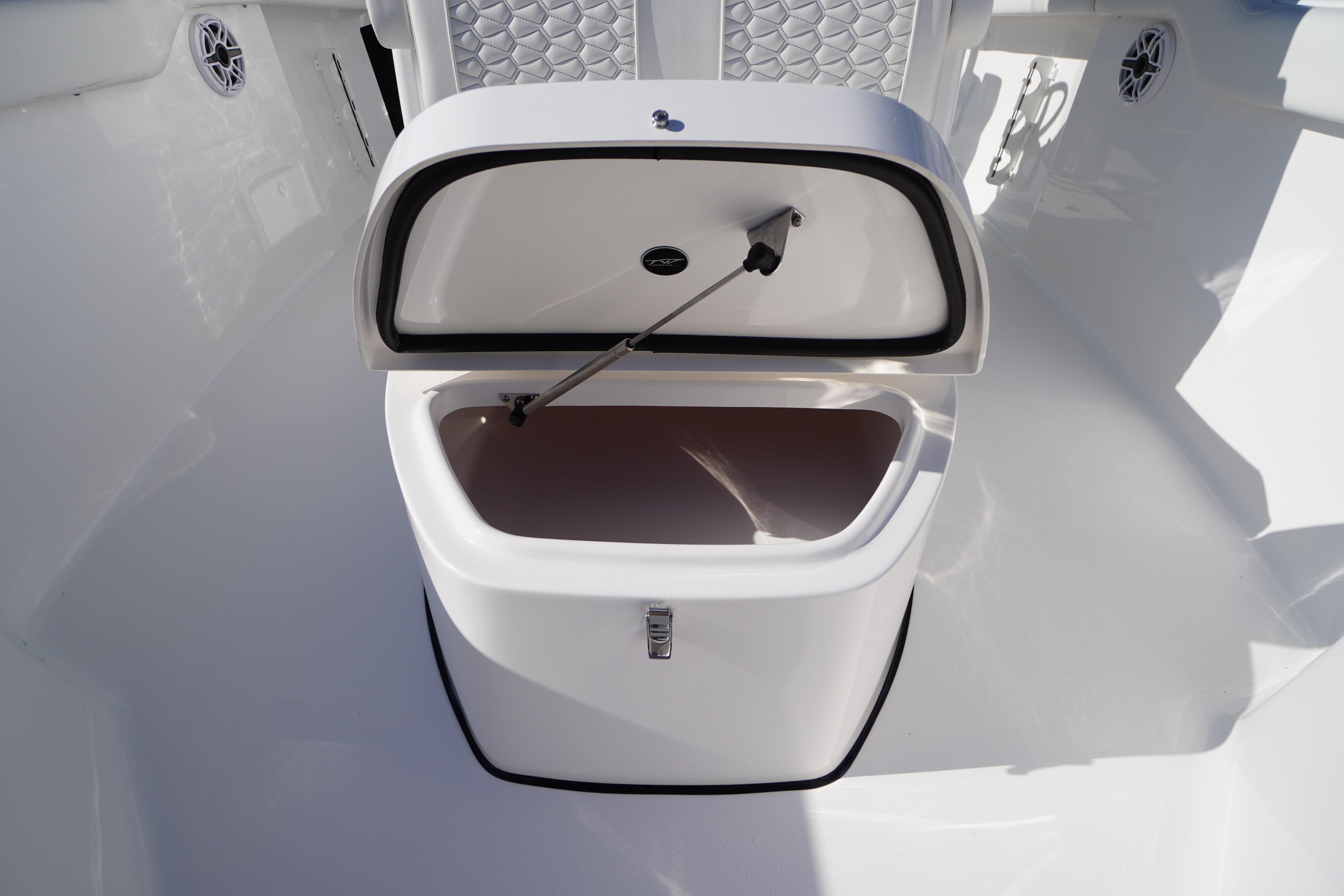 Open storage compartment on 2026 Tidewater 272 LXF boat, featuring sleek design and functionality.