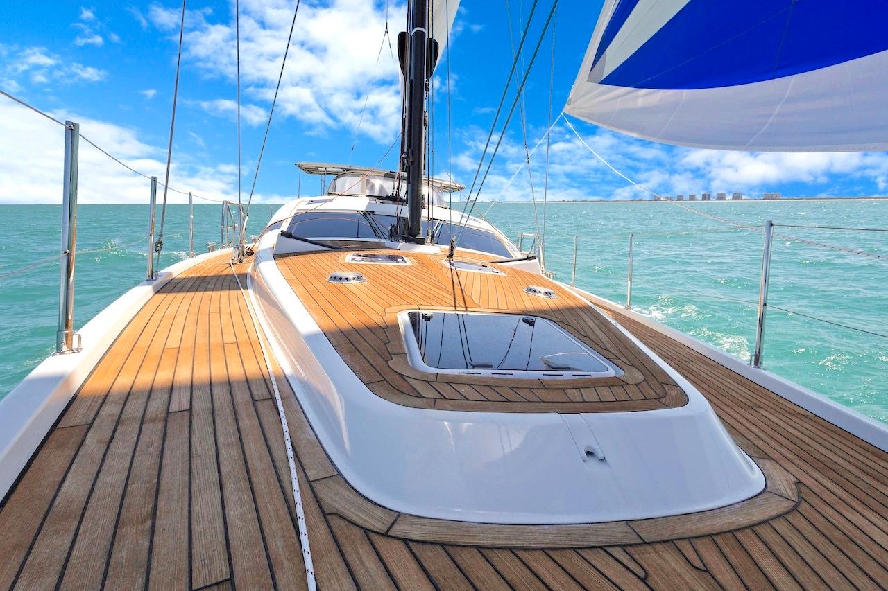 Luxurious 2011 Southerly 57 RS yacht sailing on clear blue waters under a vibrant sky.