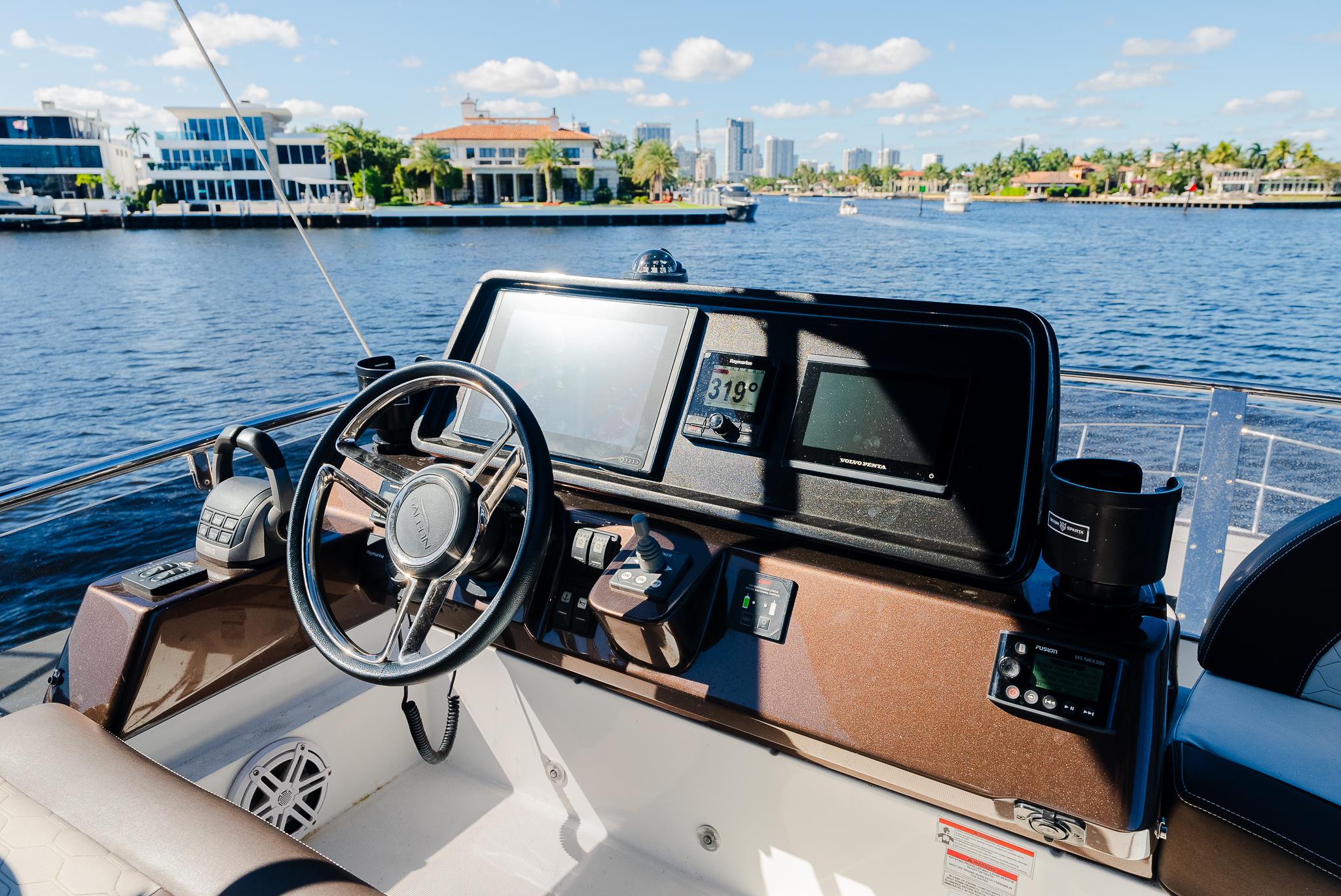 Helm of 2022 Galeon 400 Fly yacht with waterfront view.