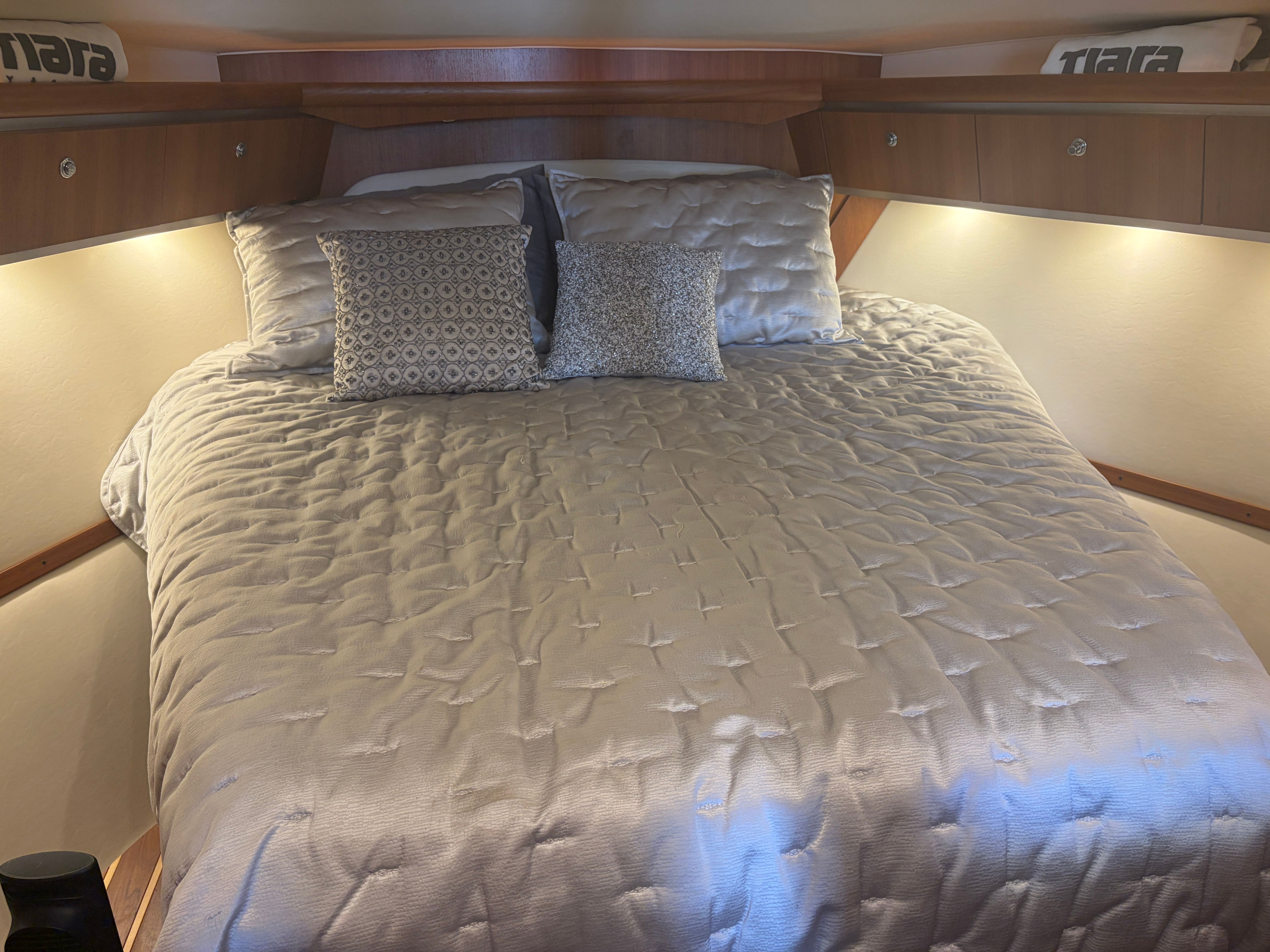 Interior of a 2005 Tiara Yachts Sovran with cozy bed.