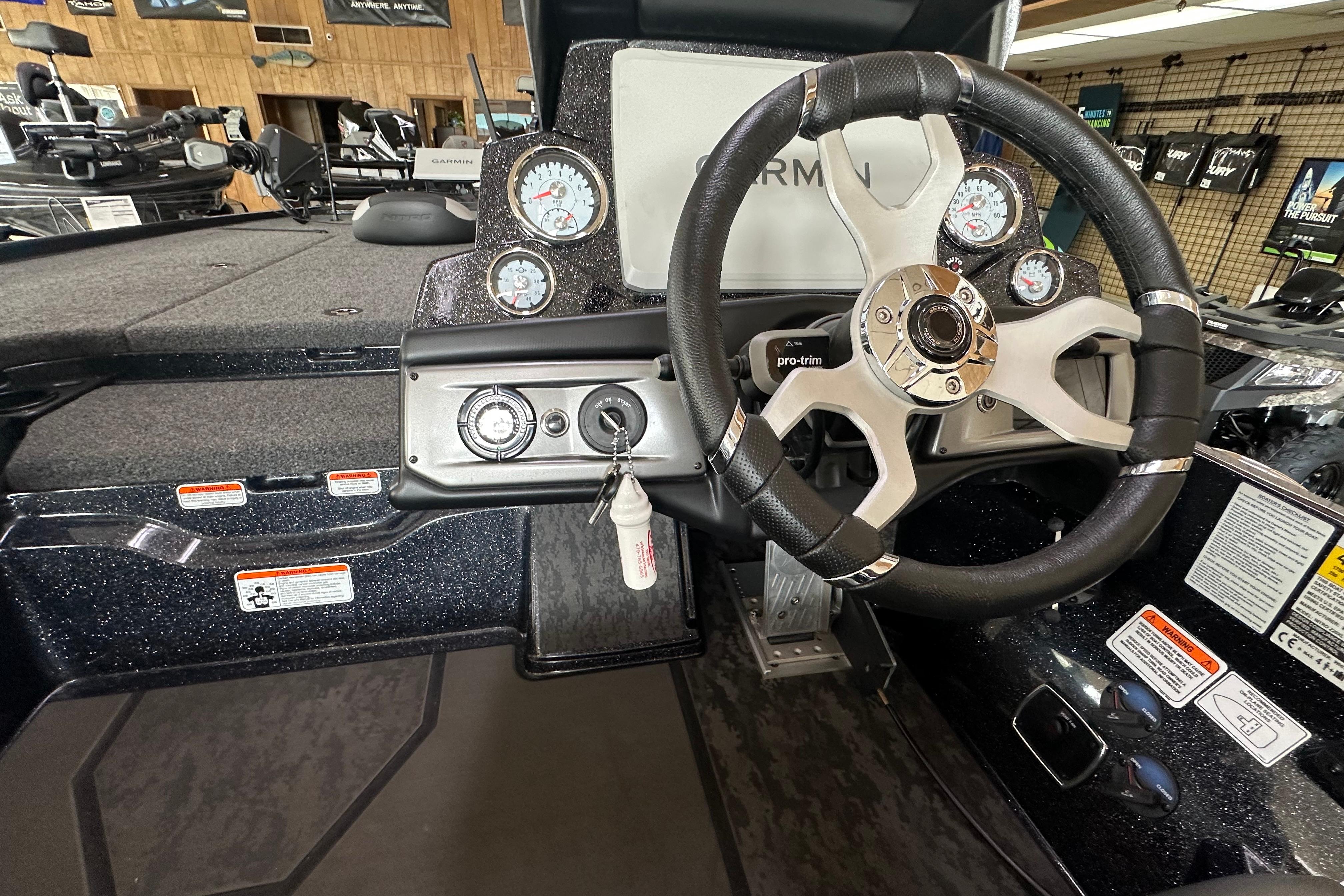 Steering console of 2025 Nitro Z20 XL Pro boat with gauges and controls.
