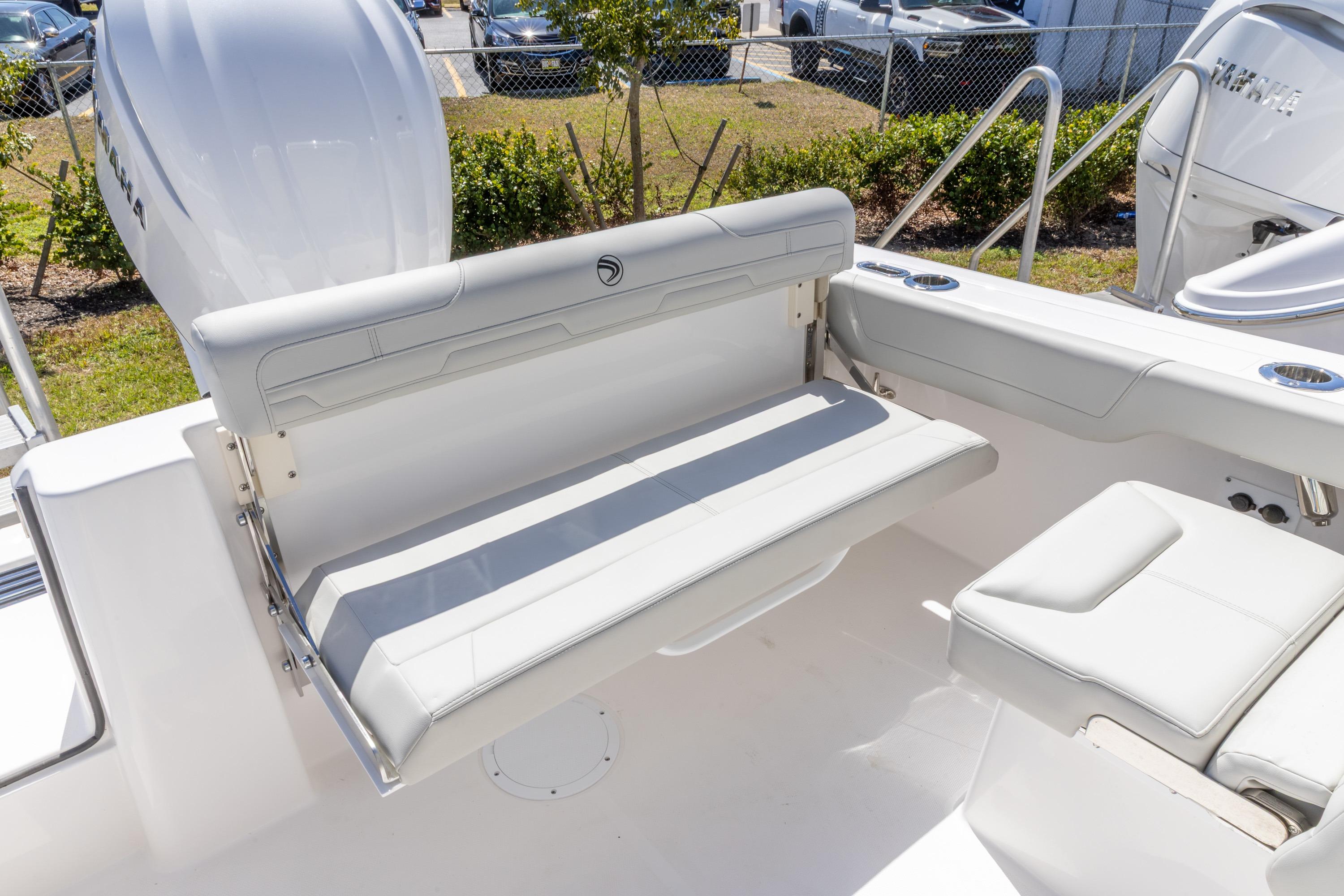 2026 Edgewater 248CX Crossover boat interior with white seating and cup holders.