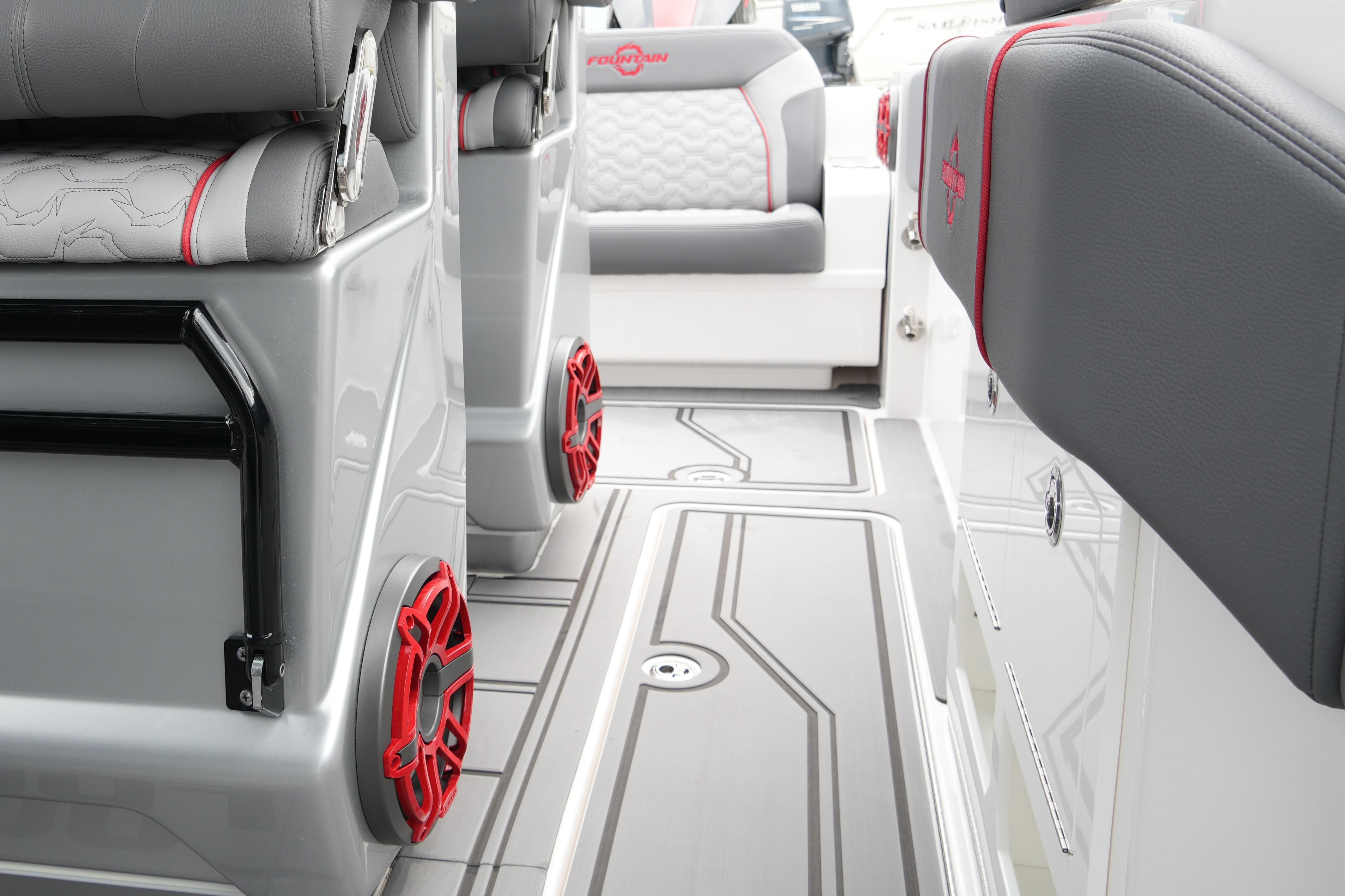 2025 Fountain 38 SCX boat interior with sleek seating and red-accented speakers.