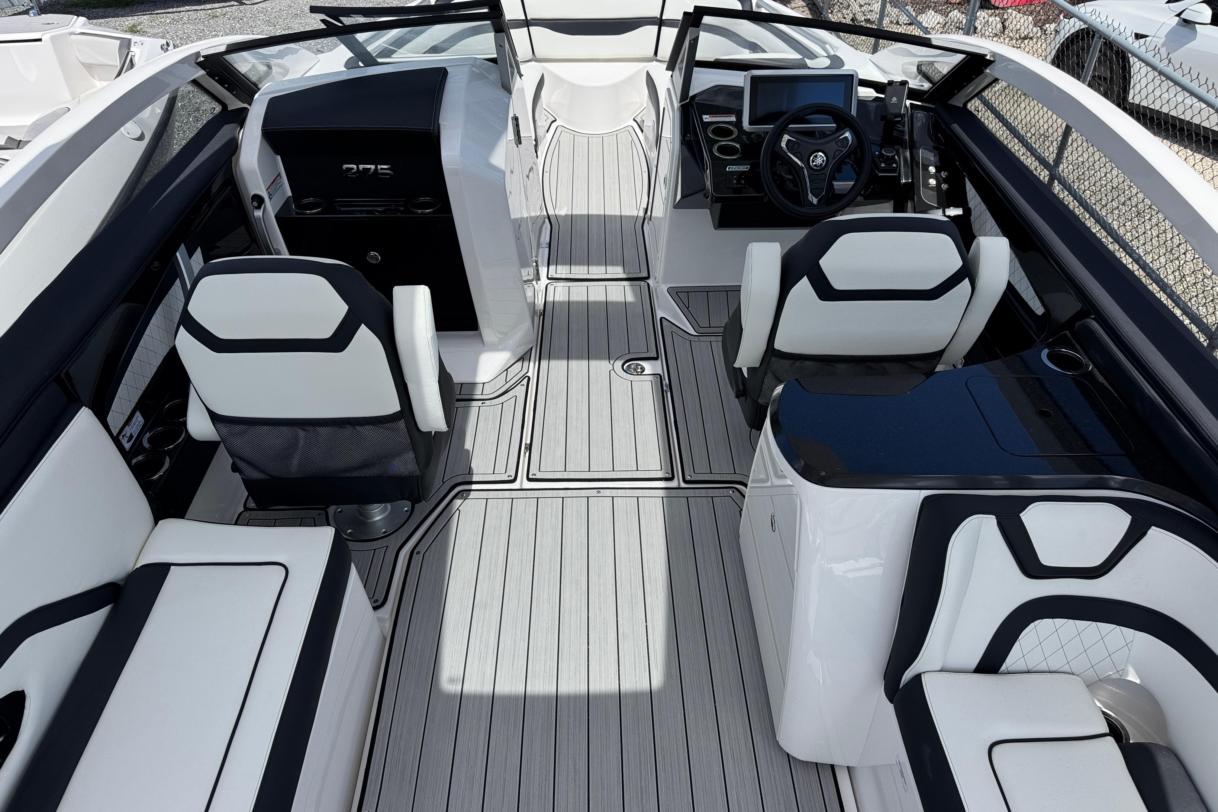 2026 Yamaha Boats 275SD interior with sleek seating and modern dashboard design.