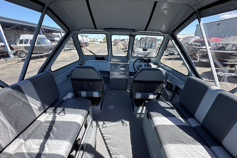 Interior of 2026 Hewescraft 180 ProV ET boat, featuring spacious seating and modern design.