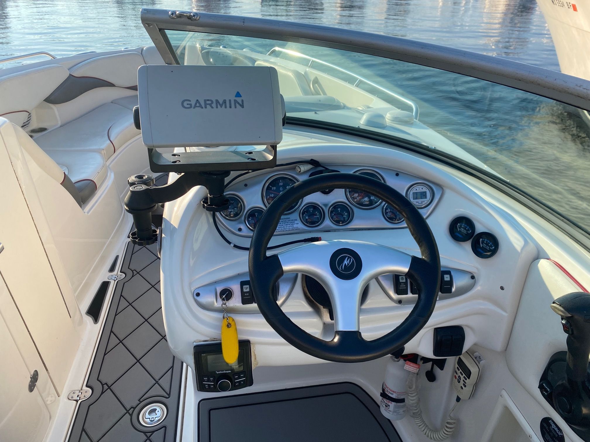 The image shows the cockpit of a 2006 Monterey 268SS Super Sport boat with a Garmin navigation system.