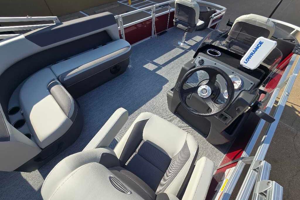 Interior of 2026 Sun Tracker Bass Buggy 18 DLX pontoon boat with seating and steering console.