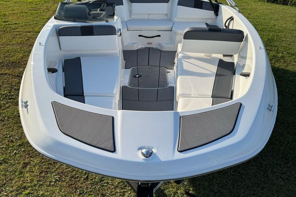 2026 Tahoe T16 boat interior with white and gray seating on grass.