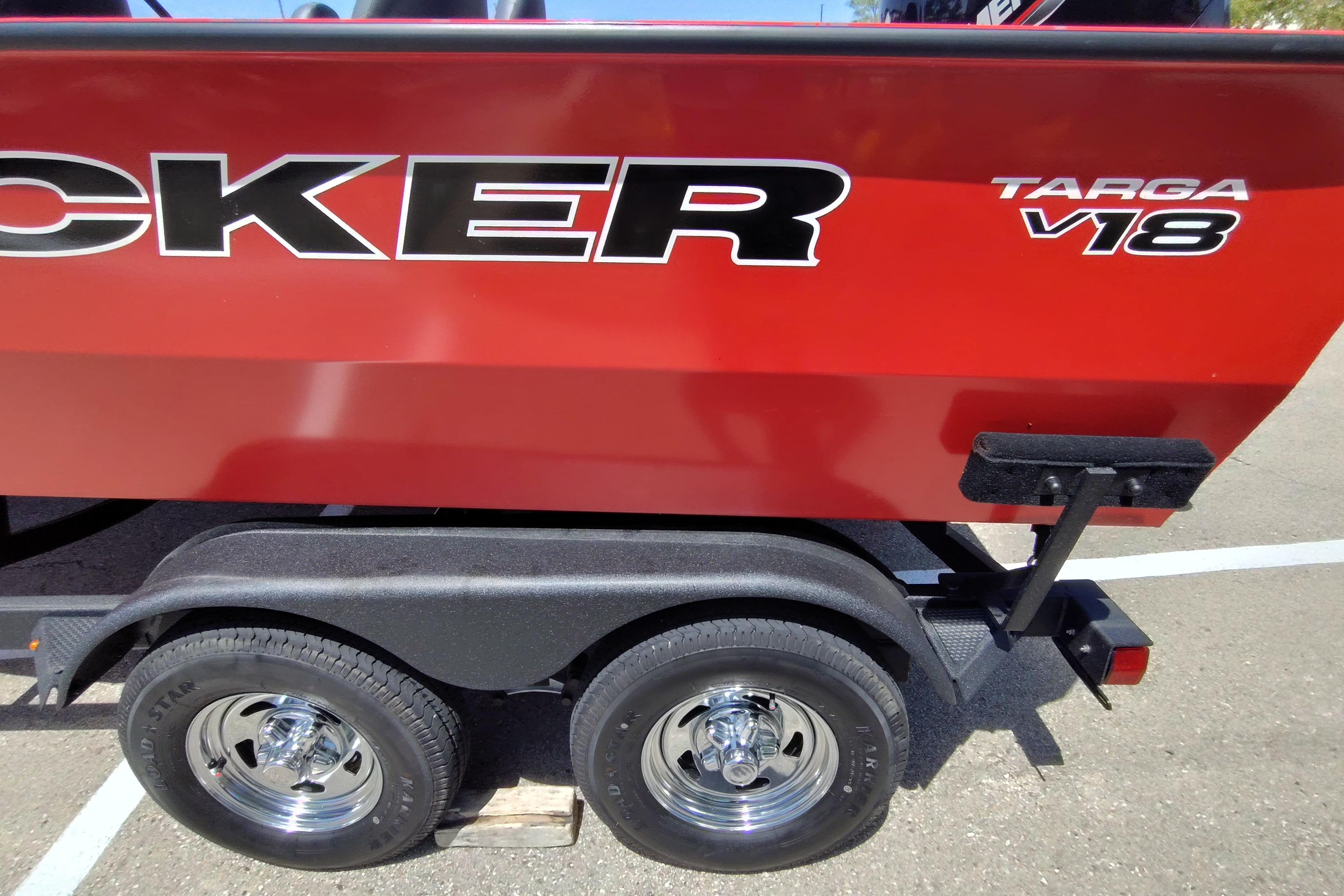 2026 Tracker Targa V-18 Combo boat on trailer, red exterior, dual wheels.