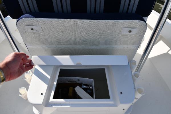 2021 Eastern 248 Center Console boat storage compartment with open lid.