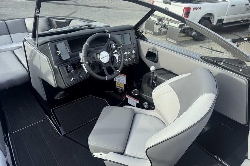 2026 Moomba Tykon boat interior with modern steering and control panel.
