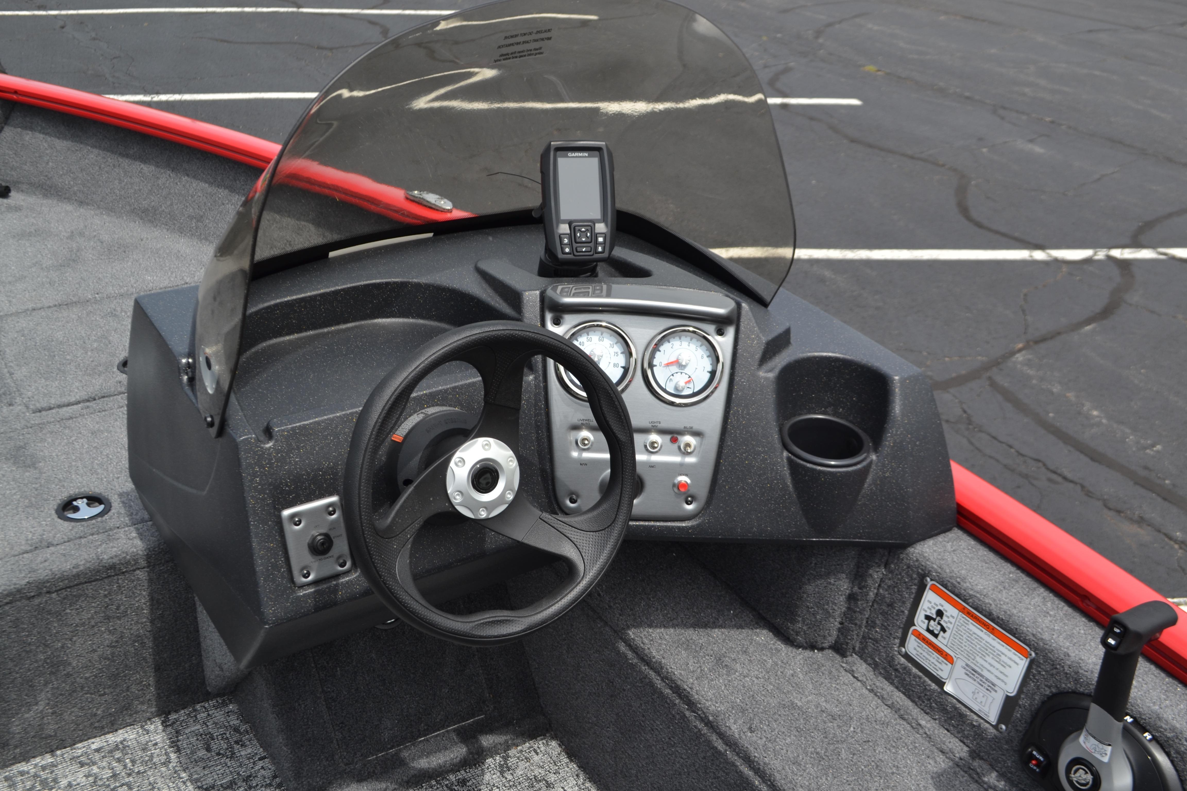 2026 Tracker Pro Guide V-16 SC boat dashboard with steering wheel and gauges.