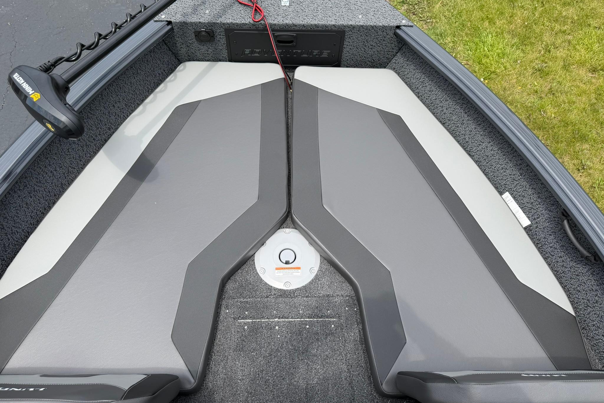 2027 Lund 1675 Adventure Sport boat interior with gray seating and Minn Kota trolling motor.